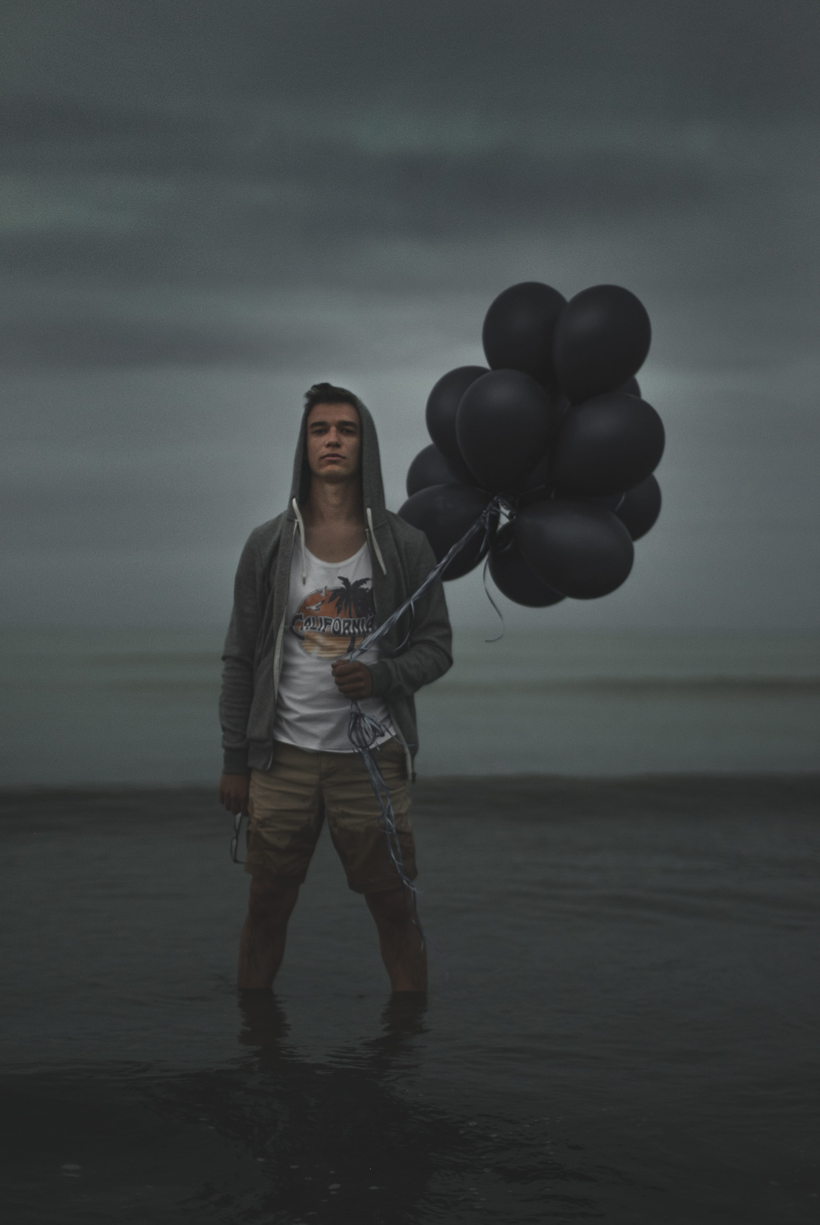 men, black, mood, coast, balloons, people, black balloon, males, sea, water, model, fashion, man, beach, sand, holding, one Person, business, caucasian Ethnicity, Phone HD Wallpaper