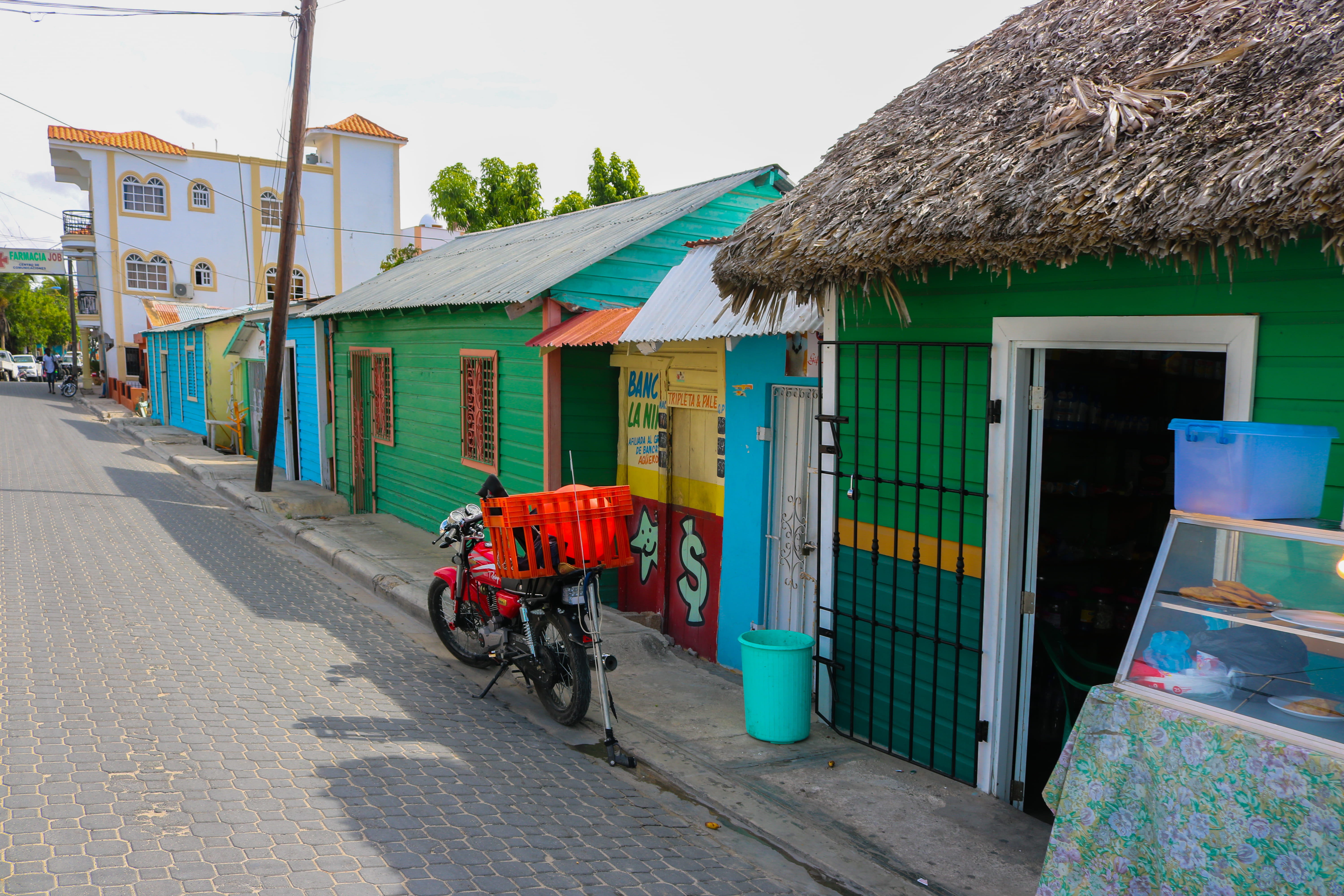residential district, colourful, red, daylight, bike, cool, mode of transportation, day, shops, real people, roof, sky blue, homes, nice, dominican republic, HD Wallpaper