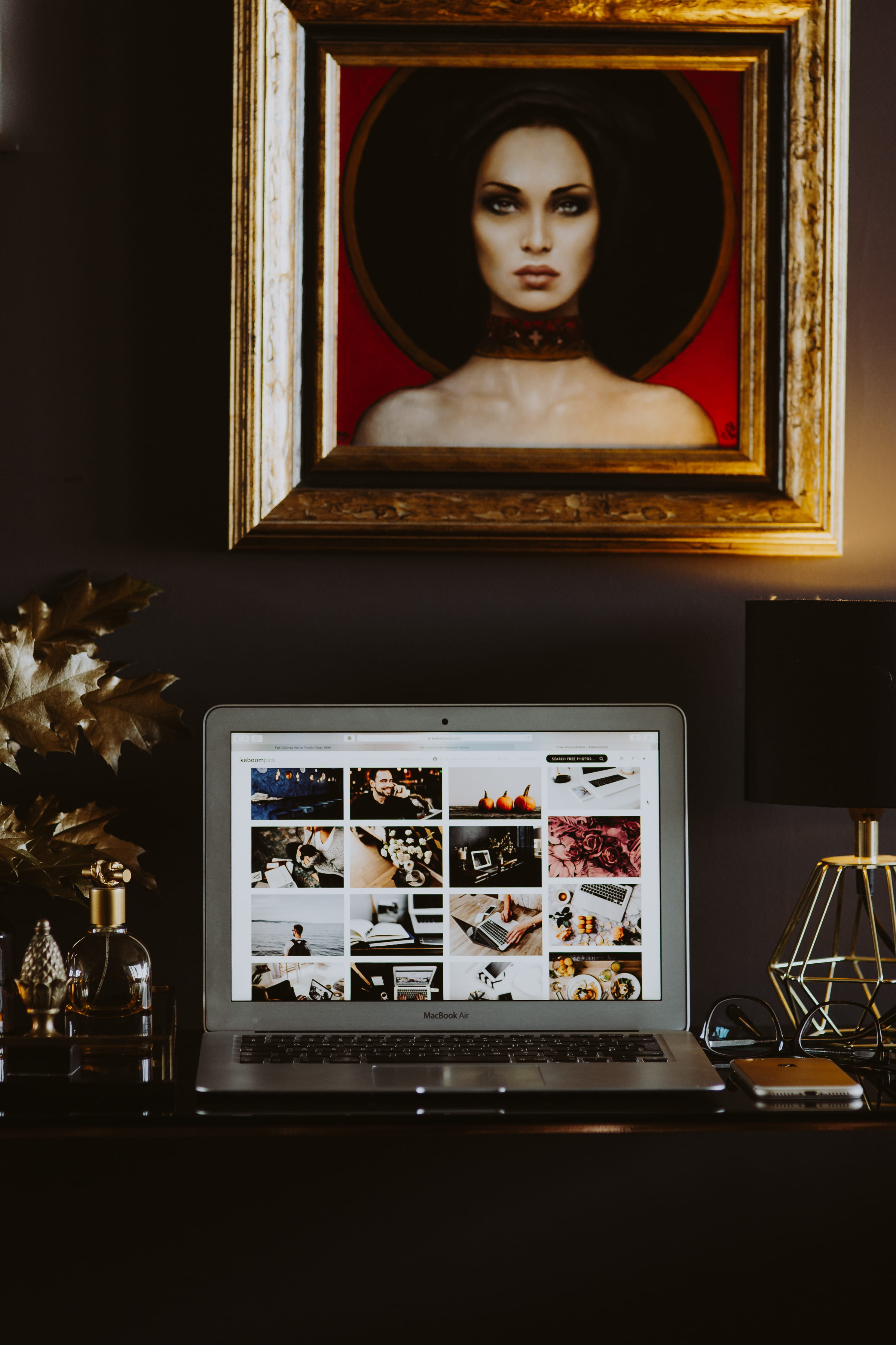 art, glass - material, black desk, laptop, painting, office, home, table, macbook, golden, indoor, mirror, 4K, gold frame, tech, window, picture, female likeness, Phone HD Wallpaper