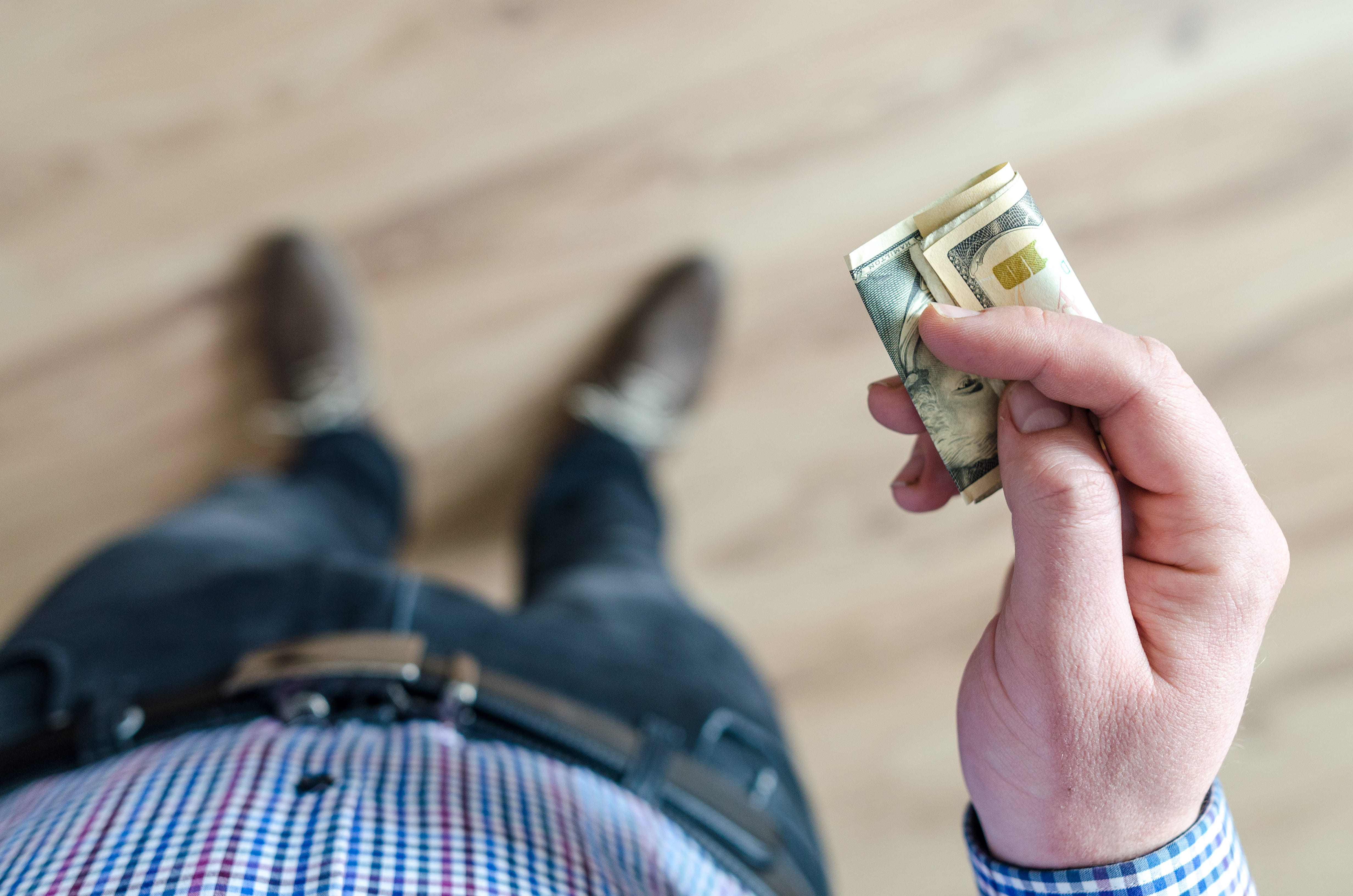 human hand, holding, limb, human limb, cash, 4K, blur, wealth, selective focus, adult, denim pants, body part, human leg, one person, banknote, shoes, HD Wallpaper