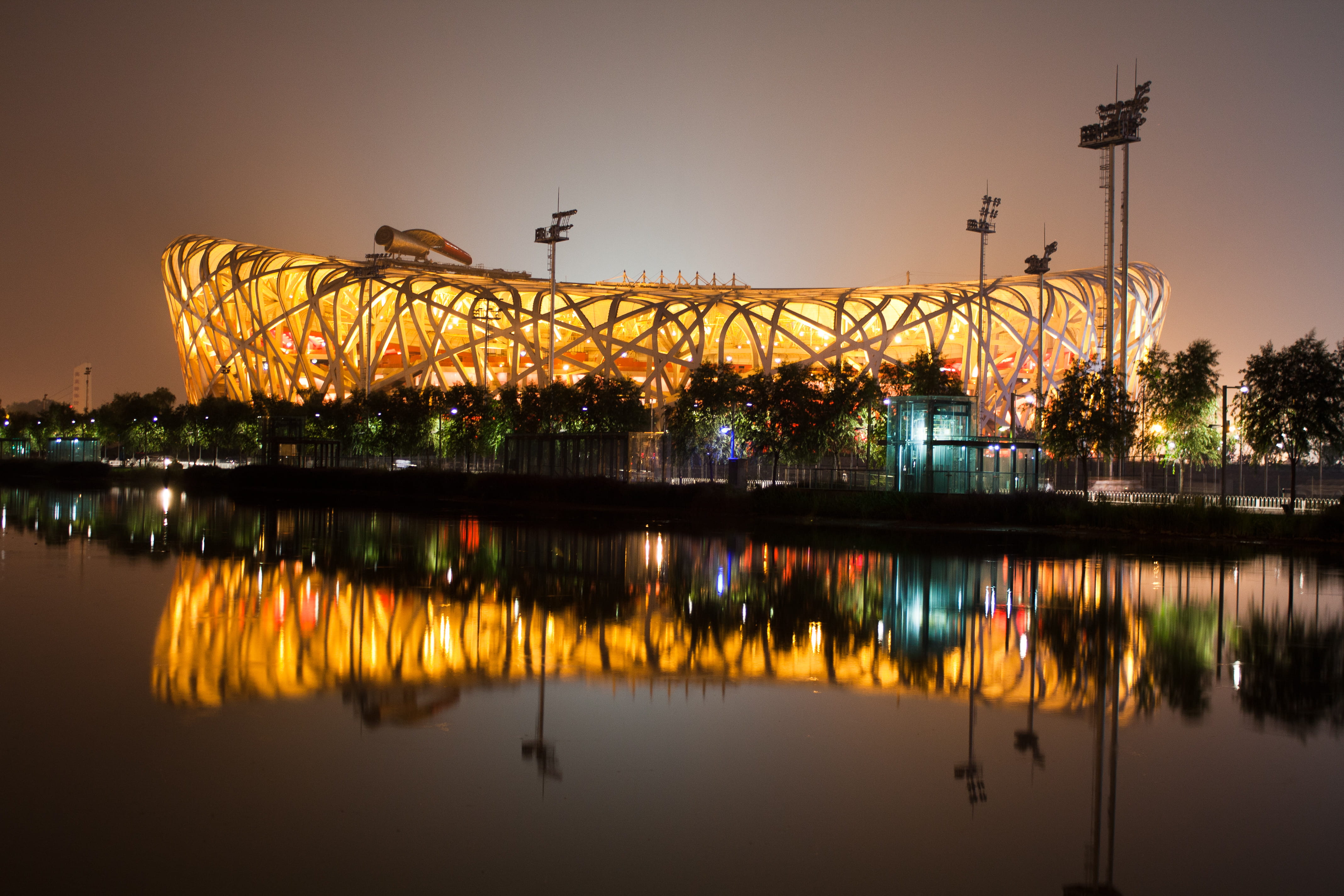 illuminated, sky, tree, convention center, building exterior, national stadium, stadium, architecture, city break, waterfront, beijing, city, orange, water ripple, HD Wallpaper