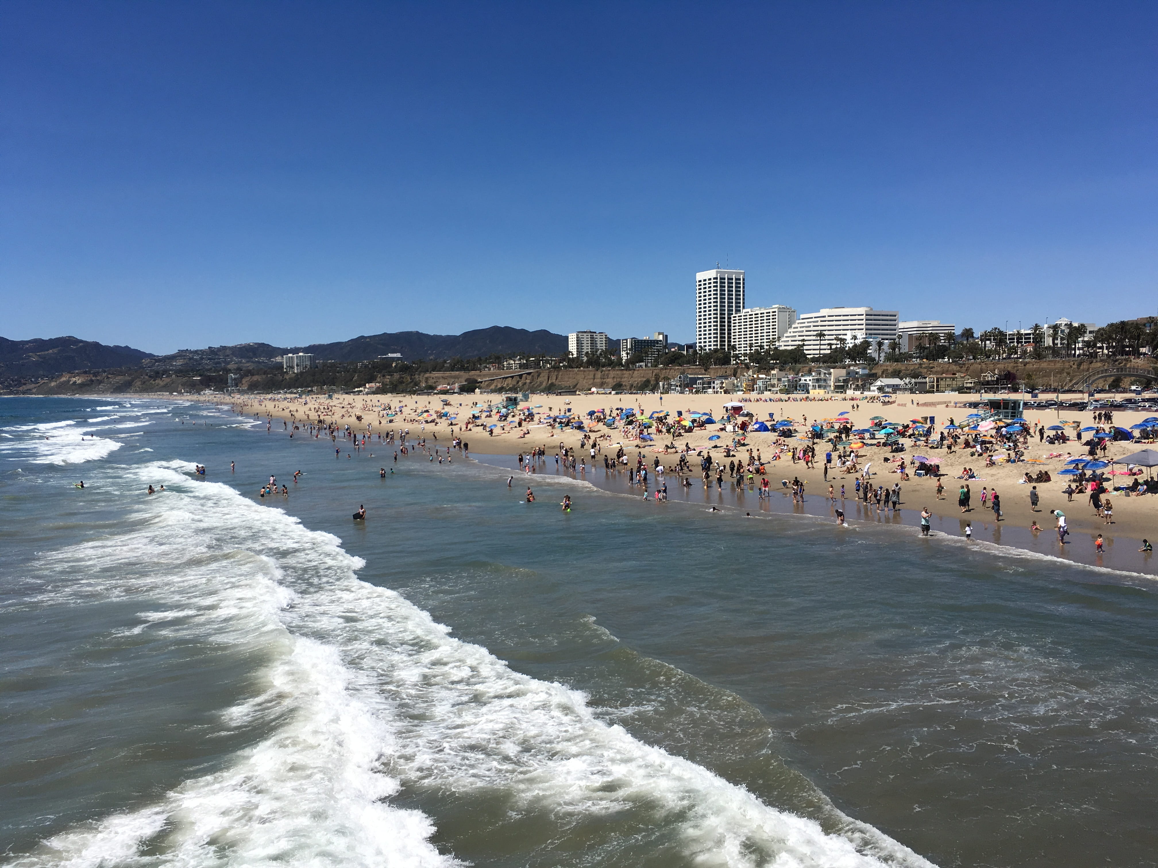 group of people, santamonica, outdoors, sky, california, waves, real people, 4K, santa monica, building exterior, ocean, clear sky, aquatic sport, architecture, HD Wallpaper