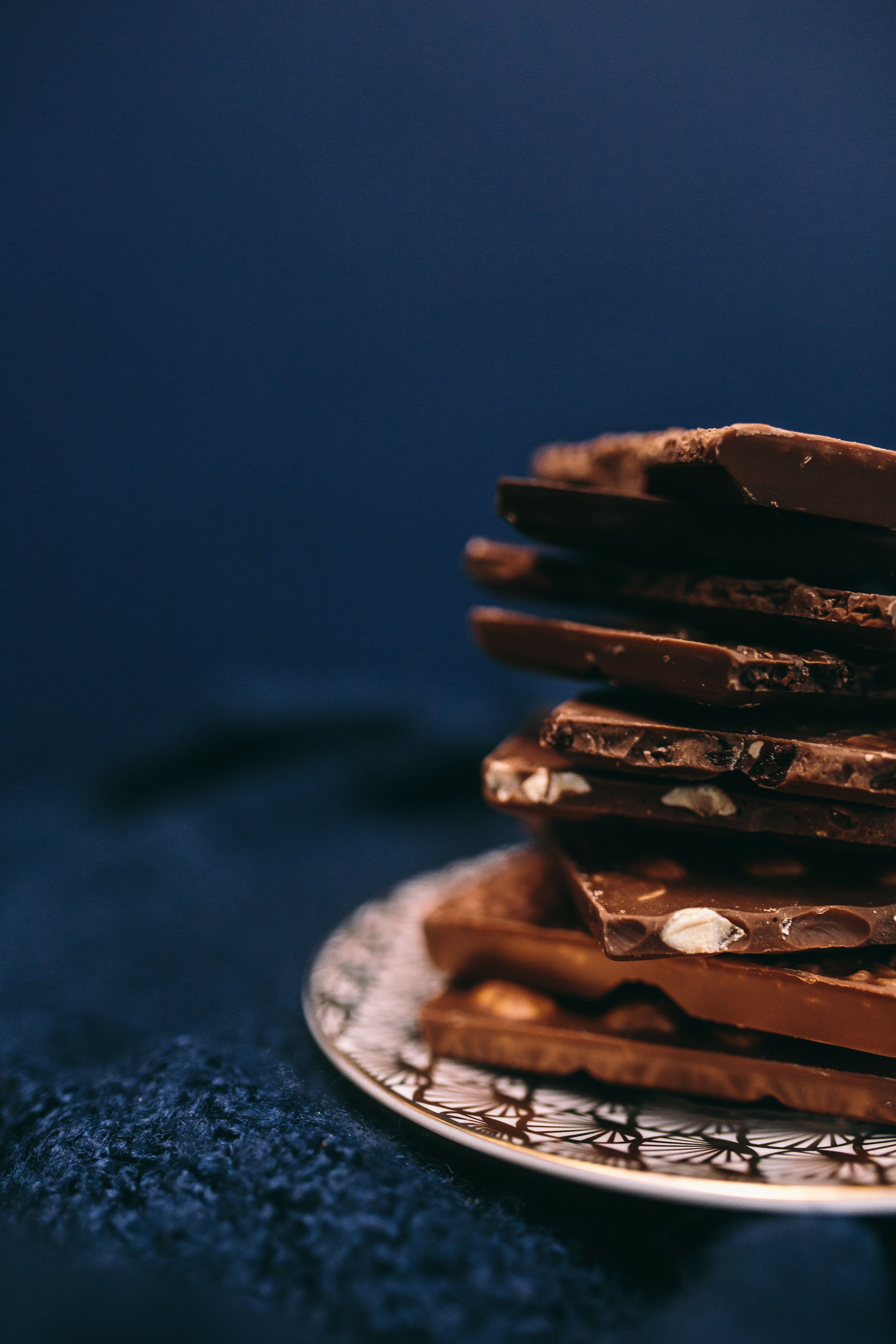 food, stack, bar, nut, selective focus, temptation, snack, 5K, Close up, no people, chocolate bar, brown, focus on foreground, ready-to-eat, blue background, Phone HD Wallpaper