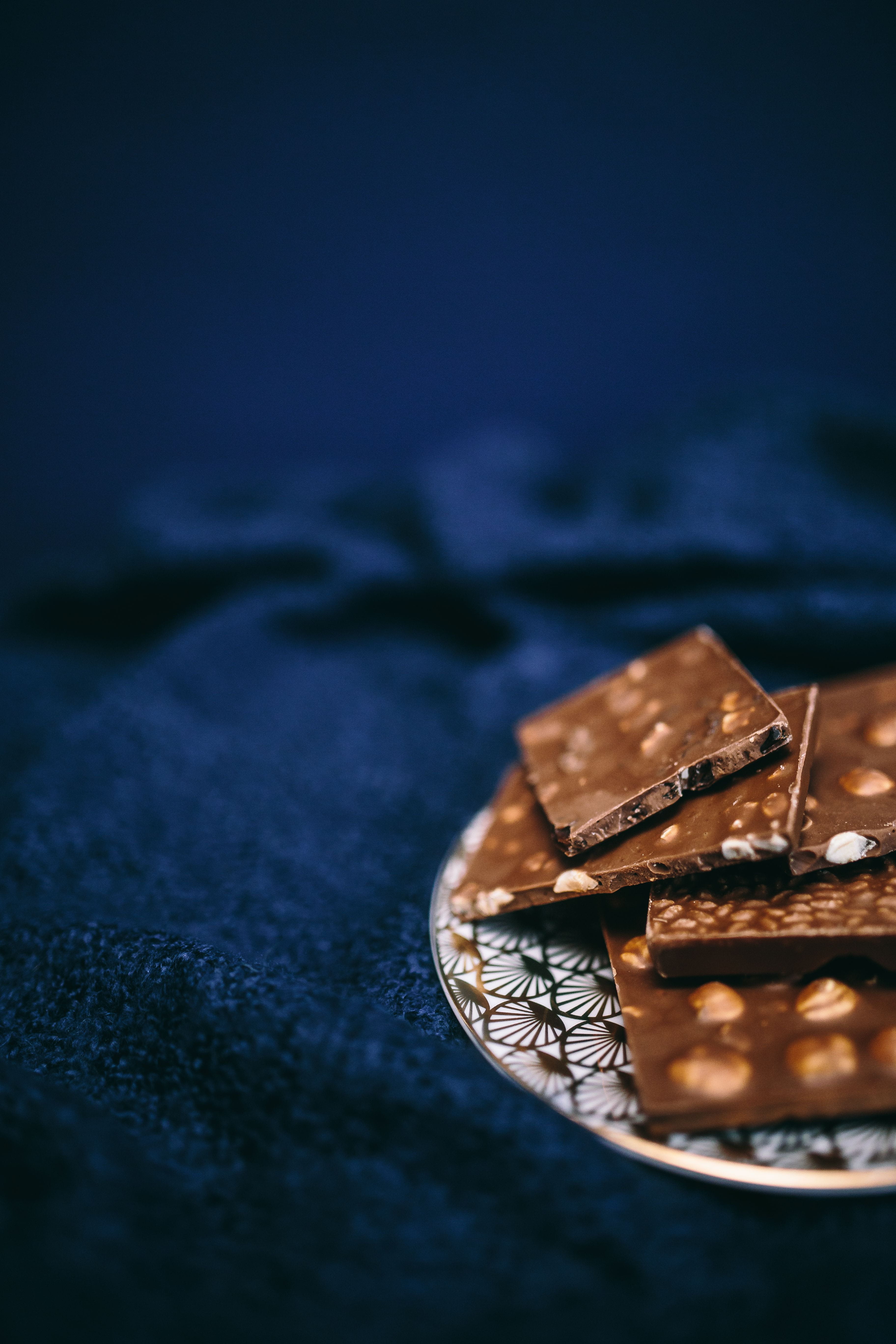 unhealthy Eating, table, blue, refreshment, indoors, chocolate, baked, dark, freshness, celebration, ready-to-eat, food and drink, nut, chocolate bar, close, Phone HD Wallpaper