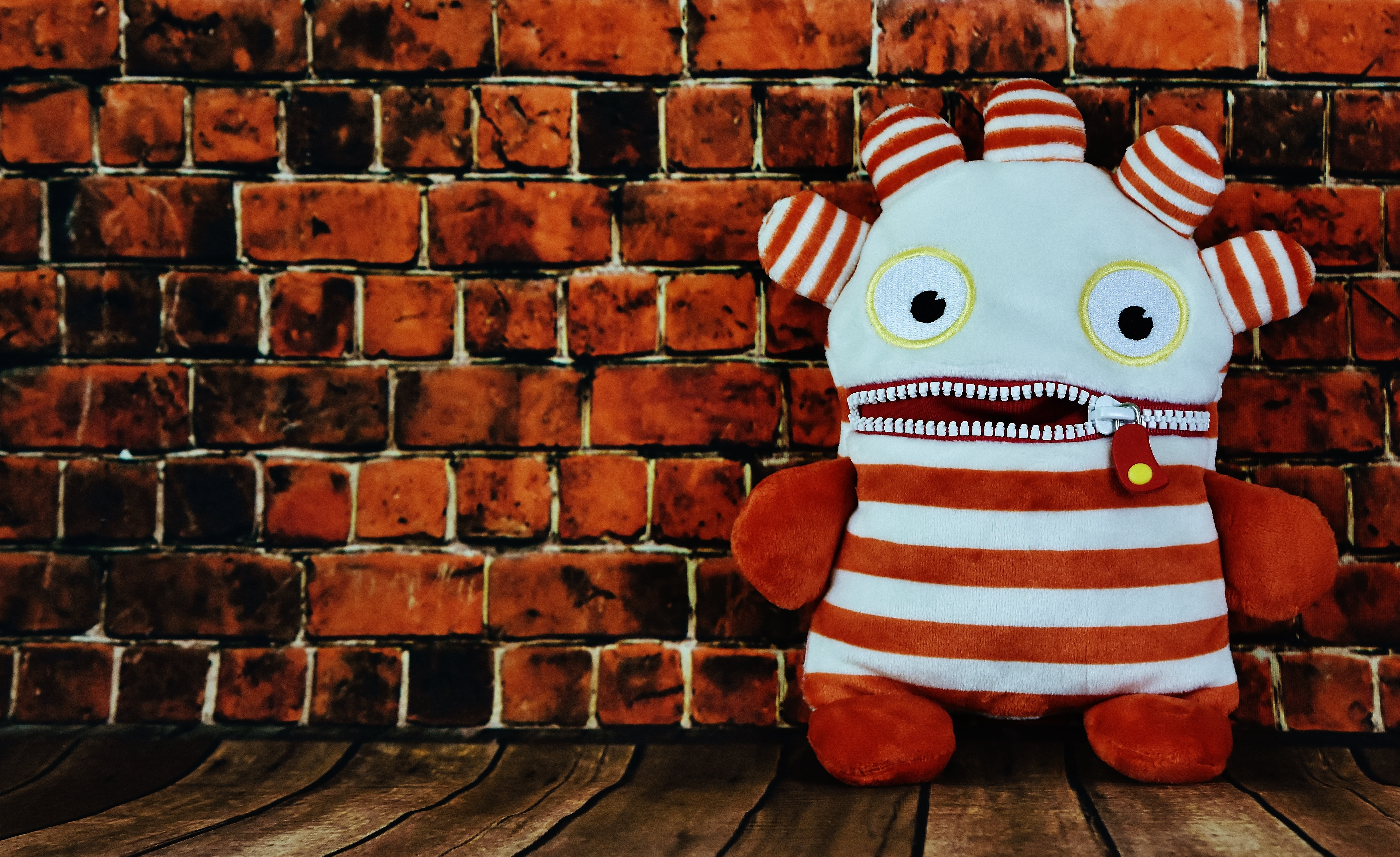 brick, human representation, 5K, ensure püppchen, obscured face, brick wall, toy, day, red, funny, indoors, humor, wall - building feature, architecture, HD Wallpaper