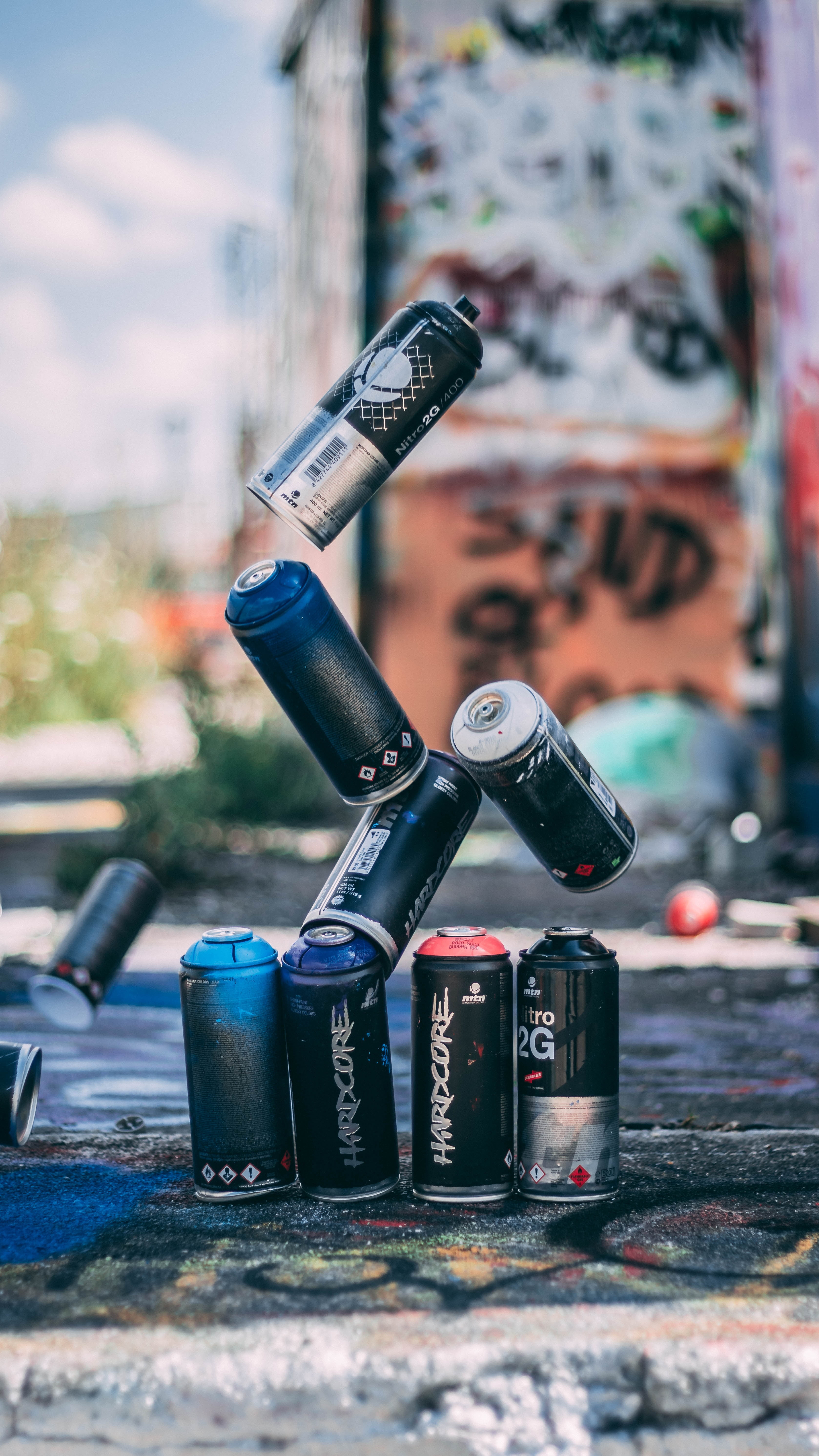selective focus, focus on foreground, metal, close-up, security, outdoors, day, built structure, western script, graffiti, choice, city, equipment, paint, Phone HD Wallpaper