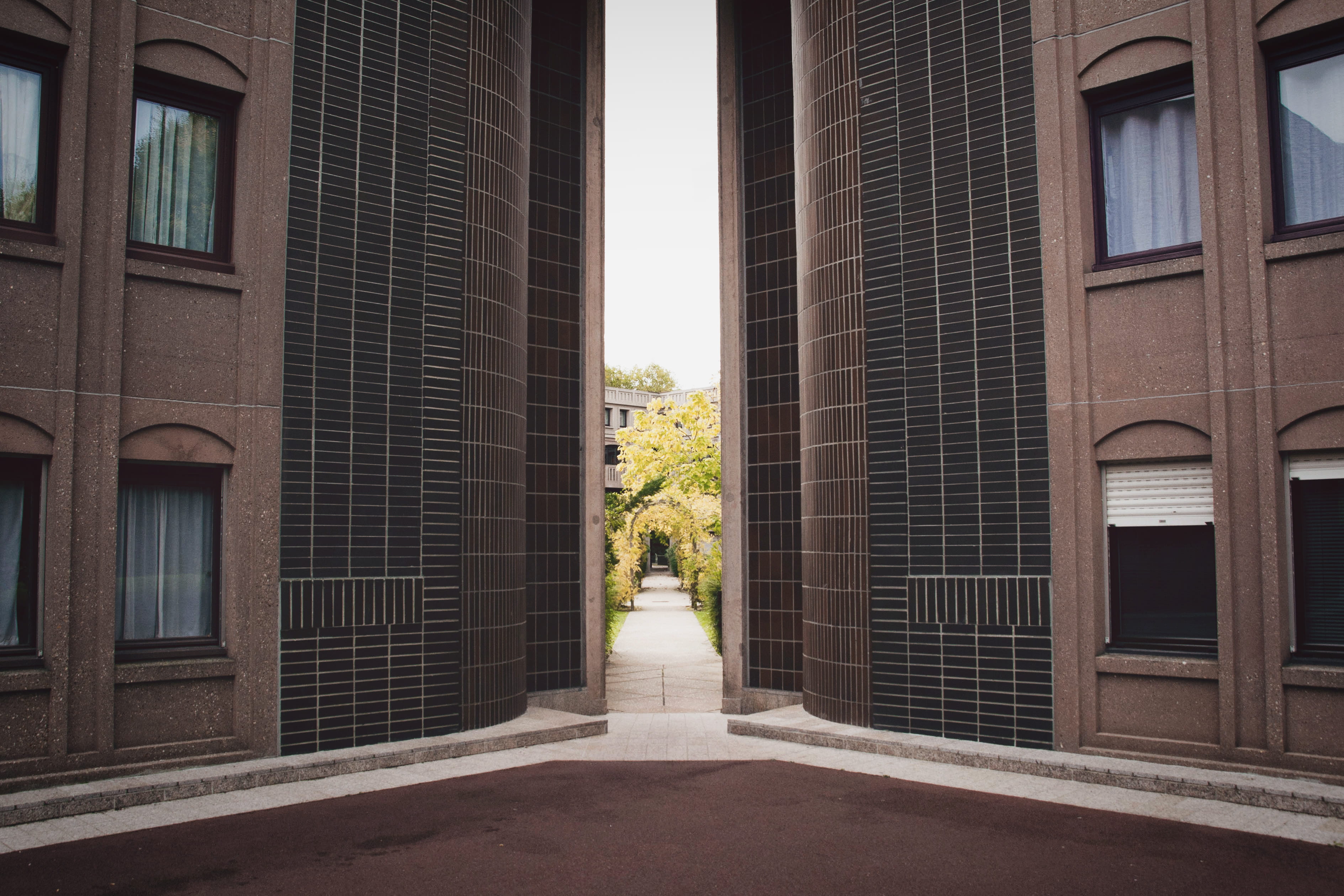 building exterior, buildings, pathway, arcades, postmodernist, rise, flower arrangement, brutalism, statue, day, event, religion, human representation, HD Wallpaper