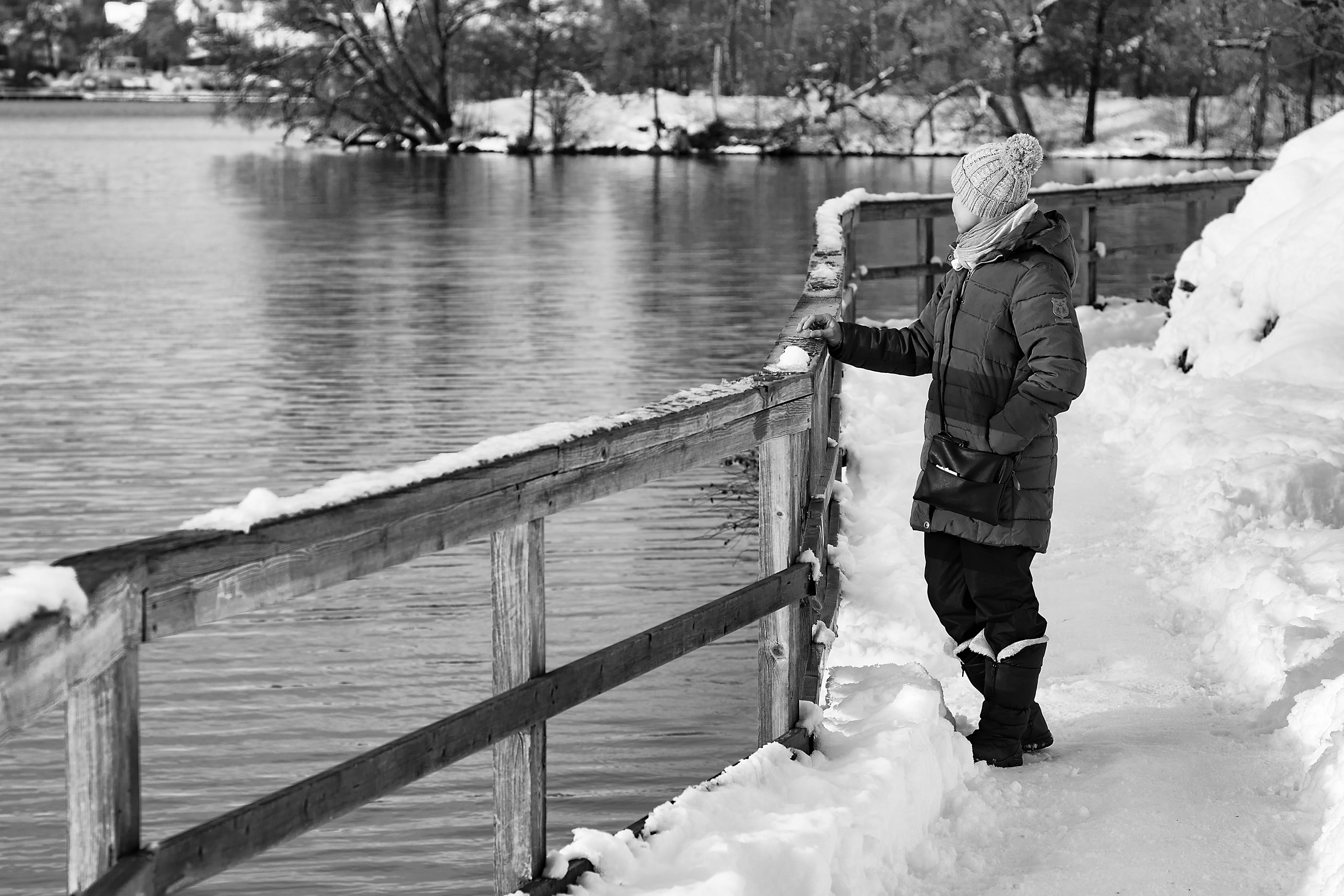 railing, one person, full length, black-and-white, girl, unhappy, nature, water, wondering, riverbank, fence, adult, clothes, real people, lifestyles, 4K, HD Wallpaper