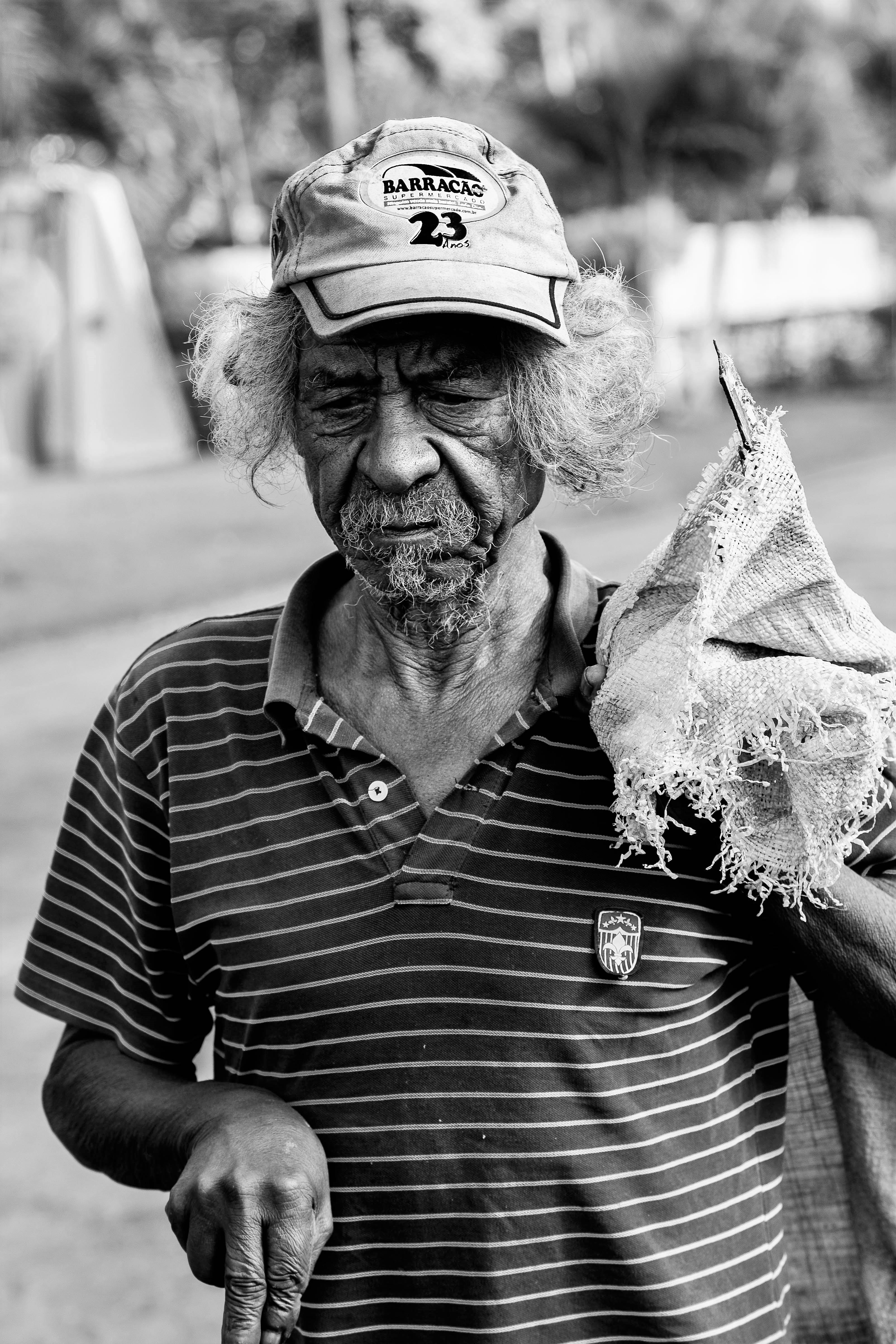 black-and-white, one person, wearing, person, senior adult, day, portrait, holding, brazil, men, focus on foreground, sack, grayscale, lifestyles, males, Phone HD Wallpaper
