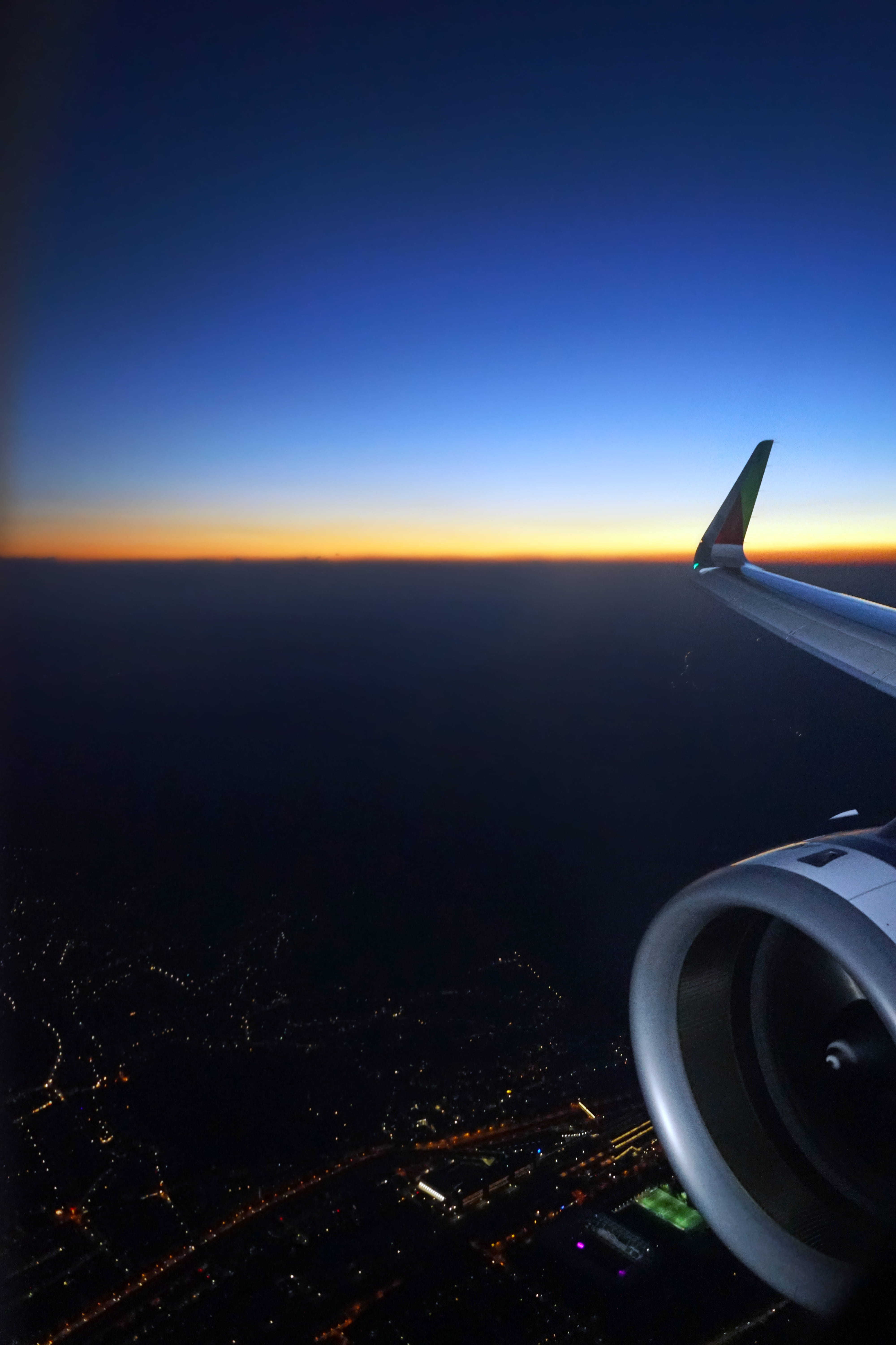 aircraft wing, airplane wing, no people, dark, cityscape, building exterior, dawn, landscape, outdoors, aerial, sunset, flying, sky, environment, architecture, Phone HD Wallpaper