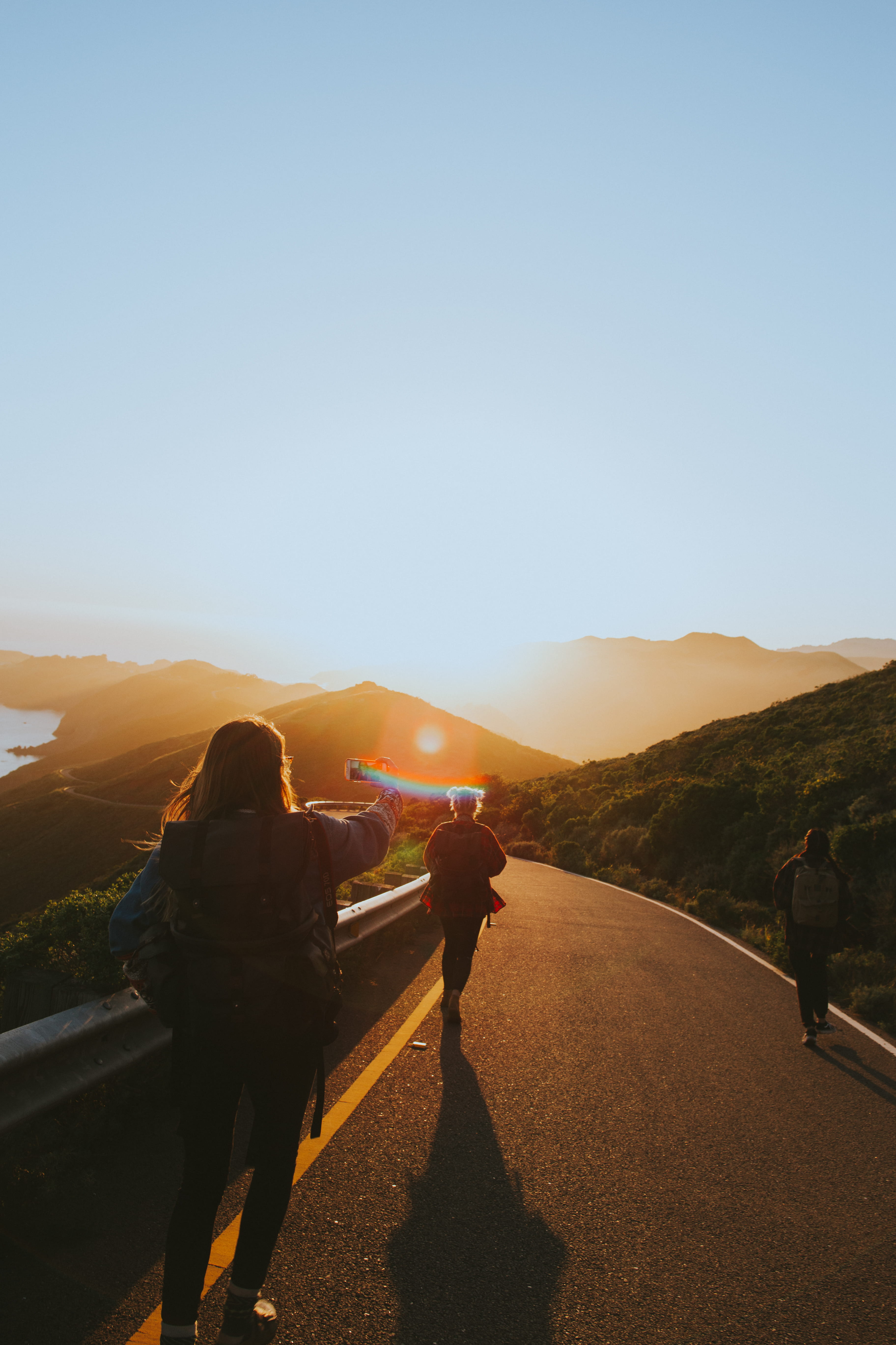 sky, road, walking, men, sunrise, outdoors, asphalt, lifestyles, non-urban scene, light, group, environment, rear view, real people, near, blue, nature, Phone HD Wallpaper