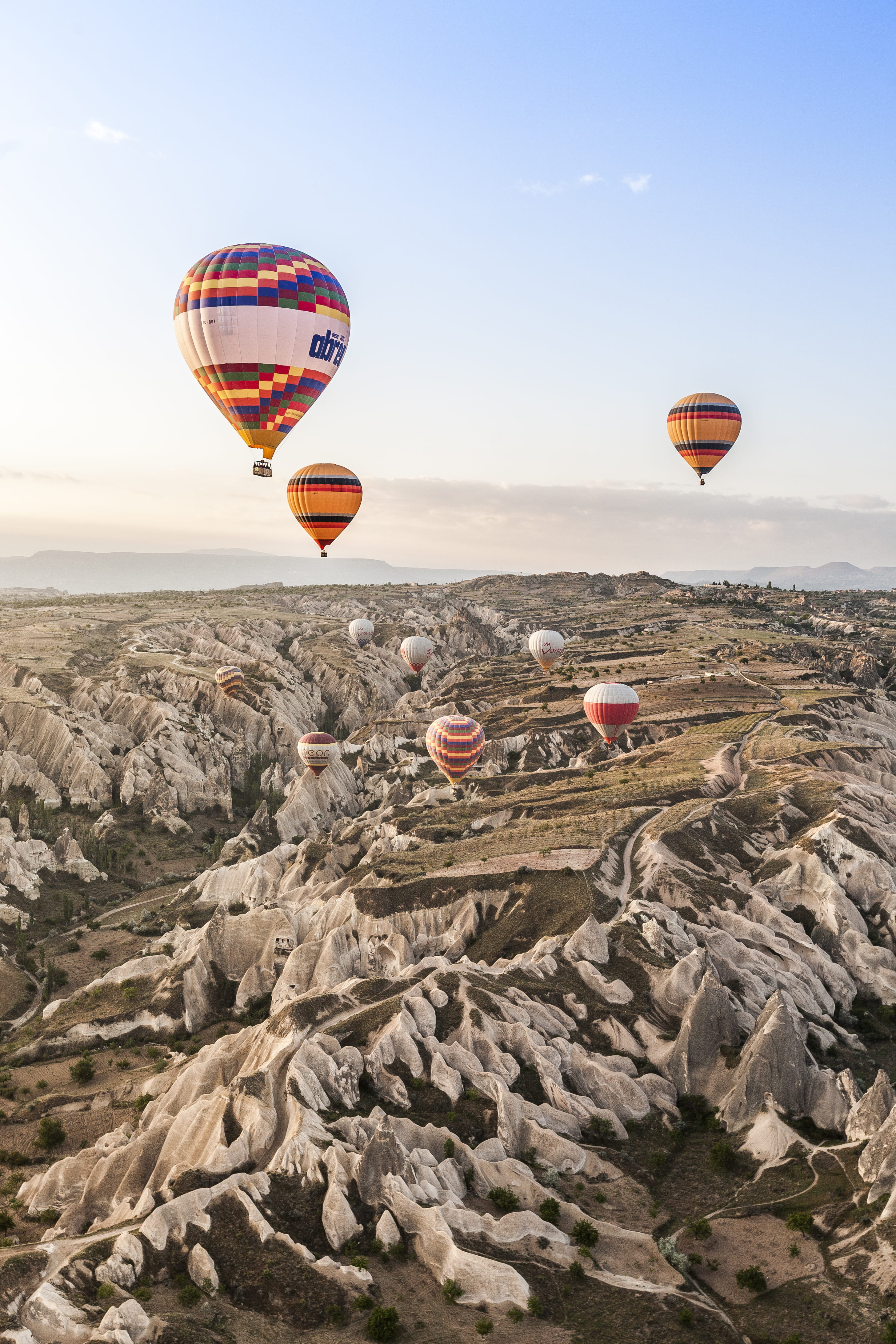 balloon, solid, beauty in nature, o, rock, p, ballooning festival, mid-air, sky, travel, 4K, air, outdoors, hot, mode of transportation, blue, non-urban scene, Phone HD Wallpaper