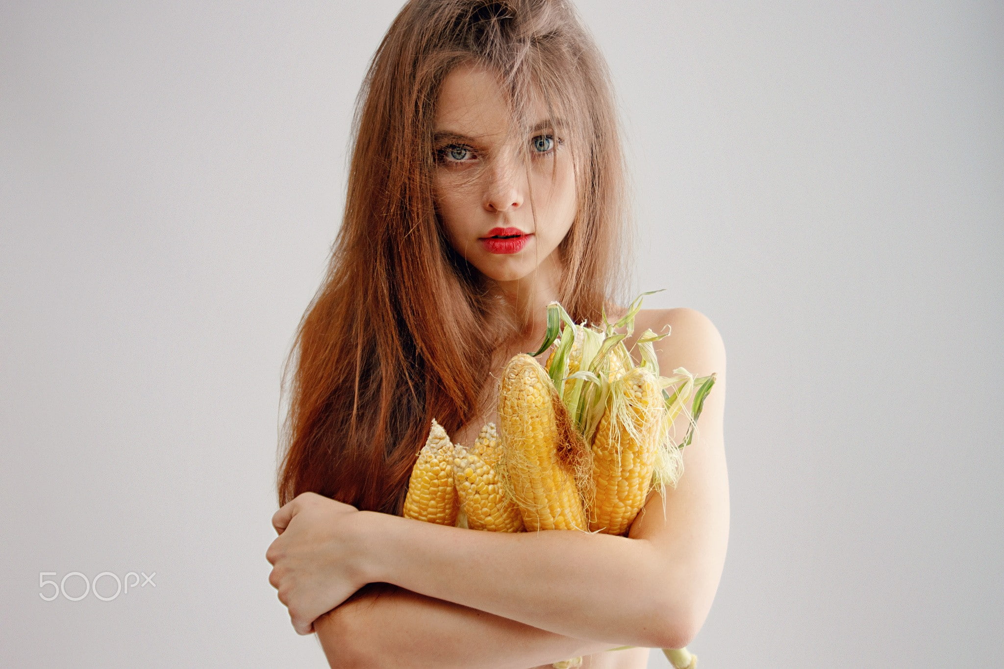 redhead, portrait, blue eyes, women, simple background, corn, red lipstick, strategic covering, 1080P, hair in face, face, HD Wallpaper