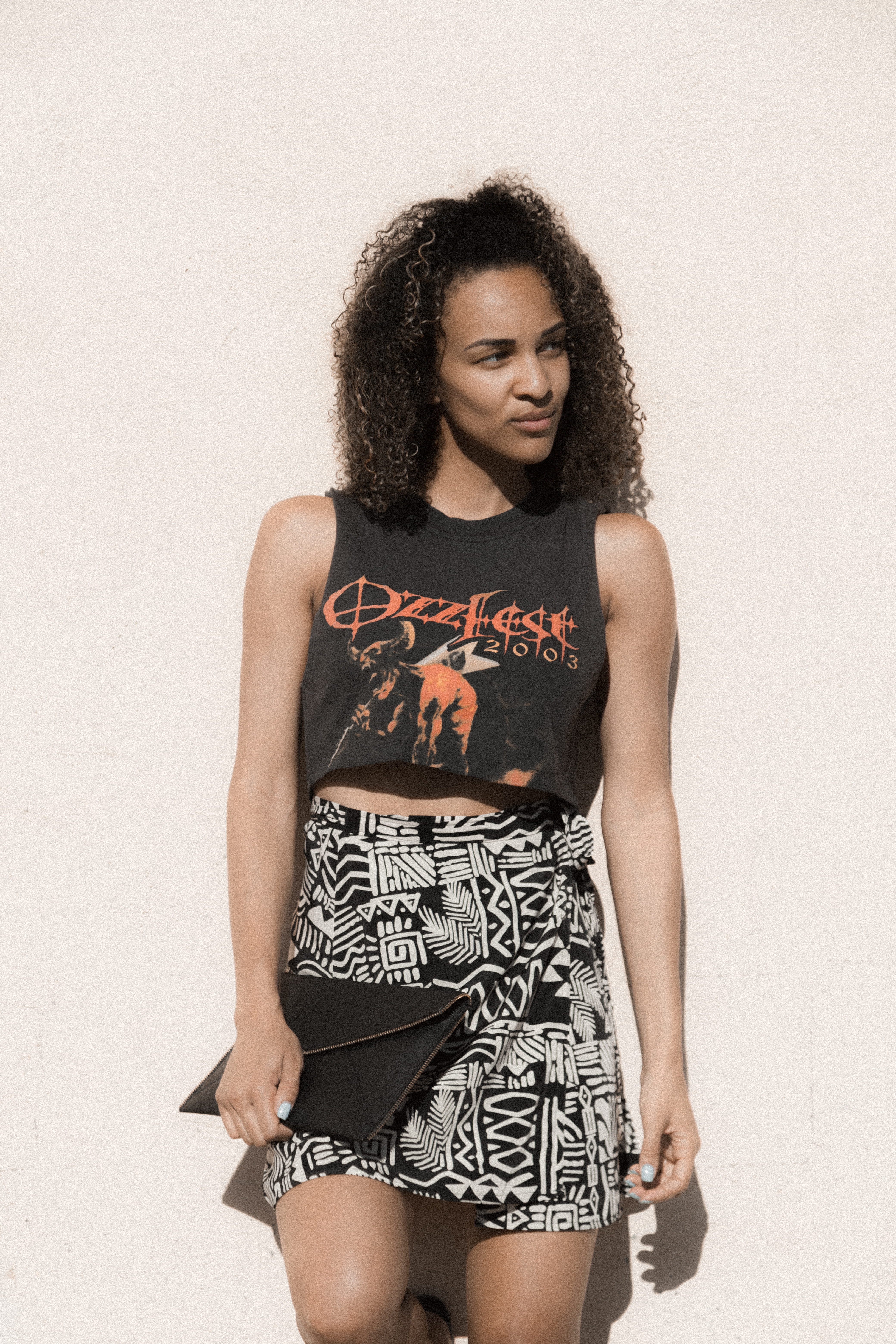 front view, young adult, text, fashion, shorts, folder, real people, style, leaning, beauty, model pose, black skin, wall - building feature, beautiful woman, Phone HD Wallpaper