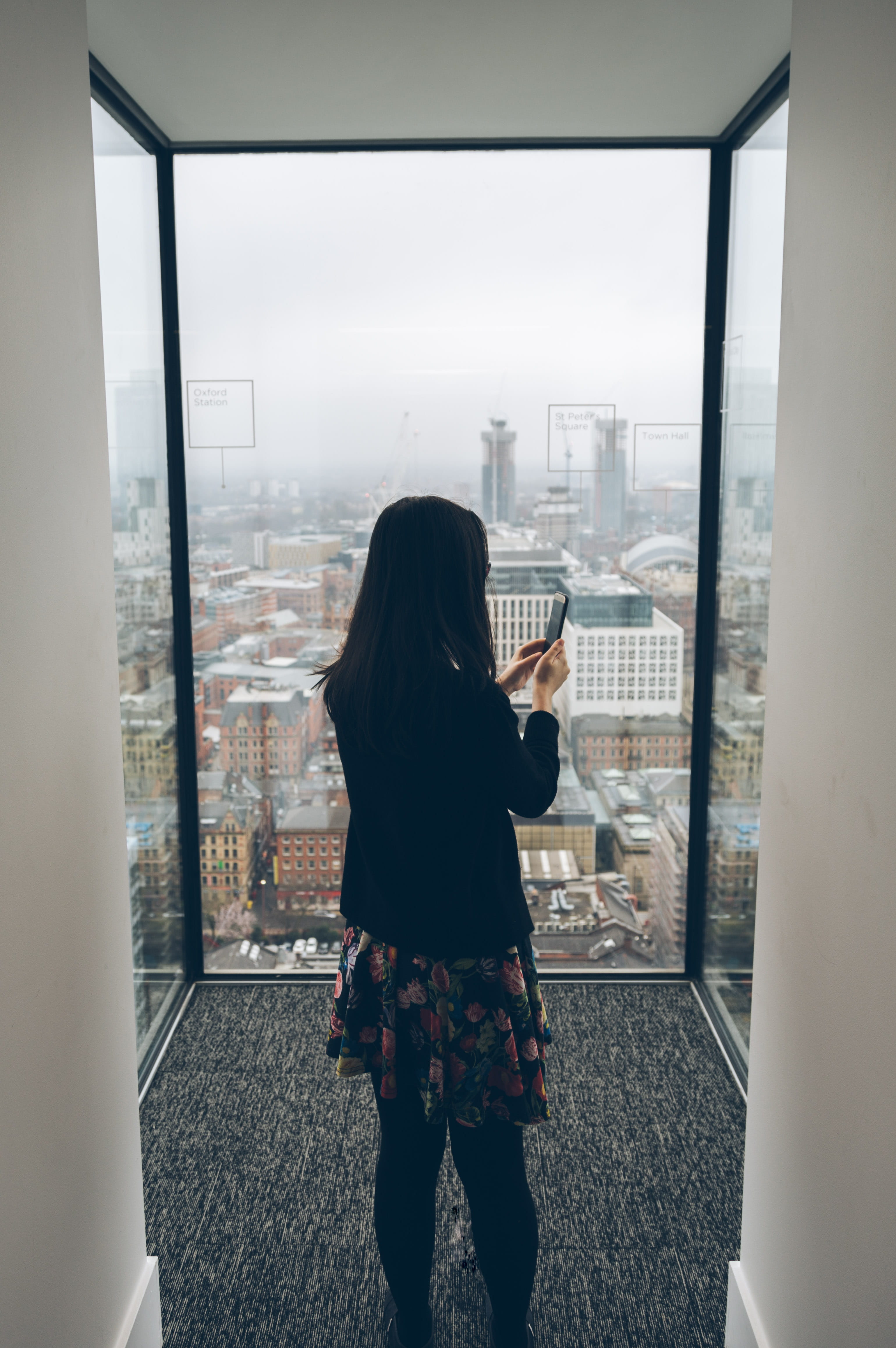 balcony, city, holding, architecture, rear view, portrait, adult, clothing, skirt, glass - material, person, one person, real people, woman, outdoors, window, Phone HD Wallpaper