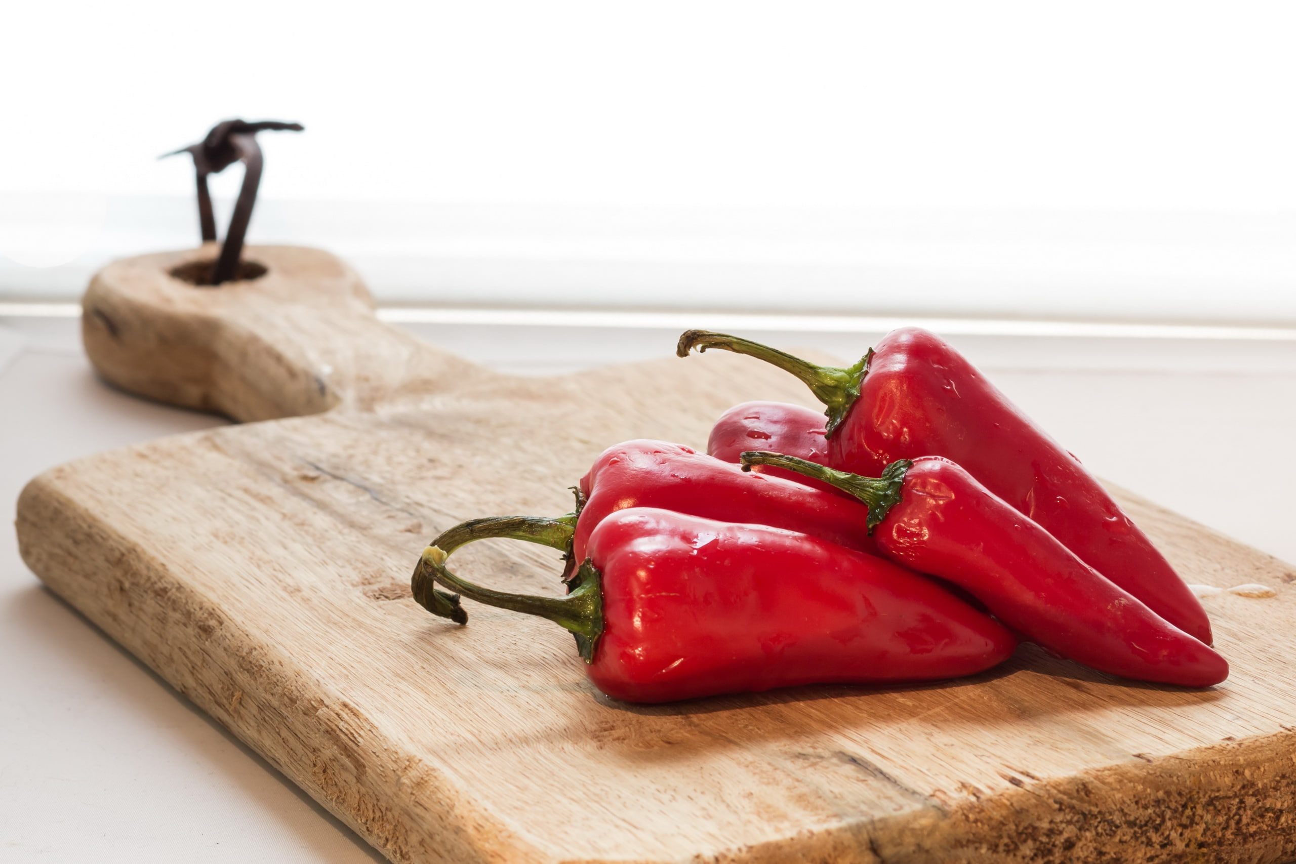 close-up, table, food, chili pepper, spice, healthy eating, cutting board, day, red chili pepper, wellbeing, 2K, pepper, still life, no people, red, focus on foreground, HD Wallpaper
