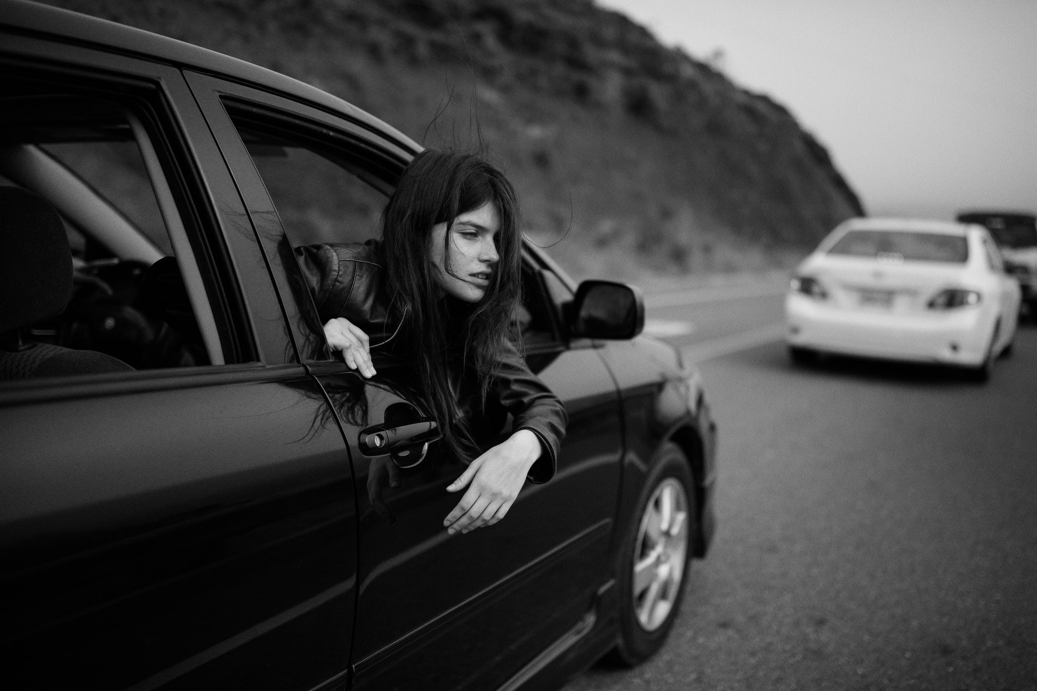 messy hair, monochrome, looking out window, model, Jesse Herzog, hair in face, car, women, leather jackets, 1080P, Raluca Vlad, HD Wallpaper