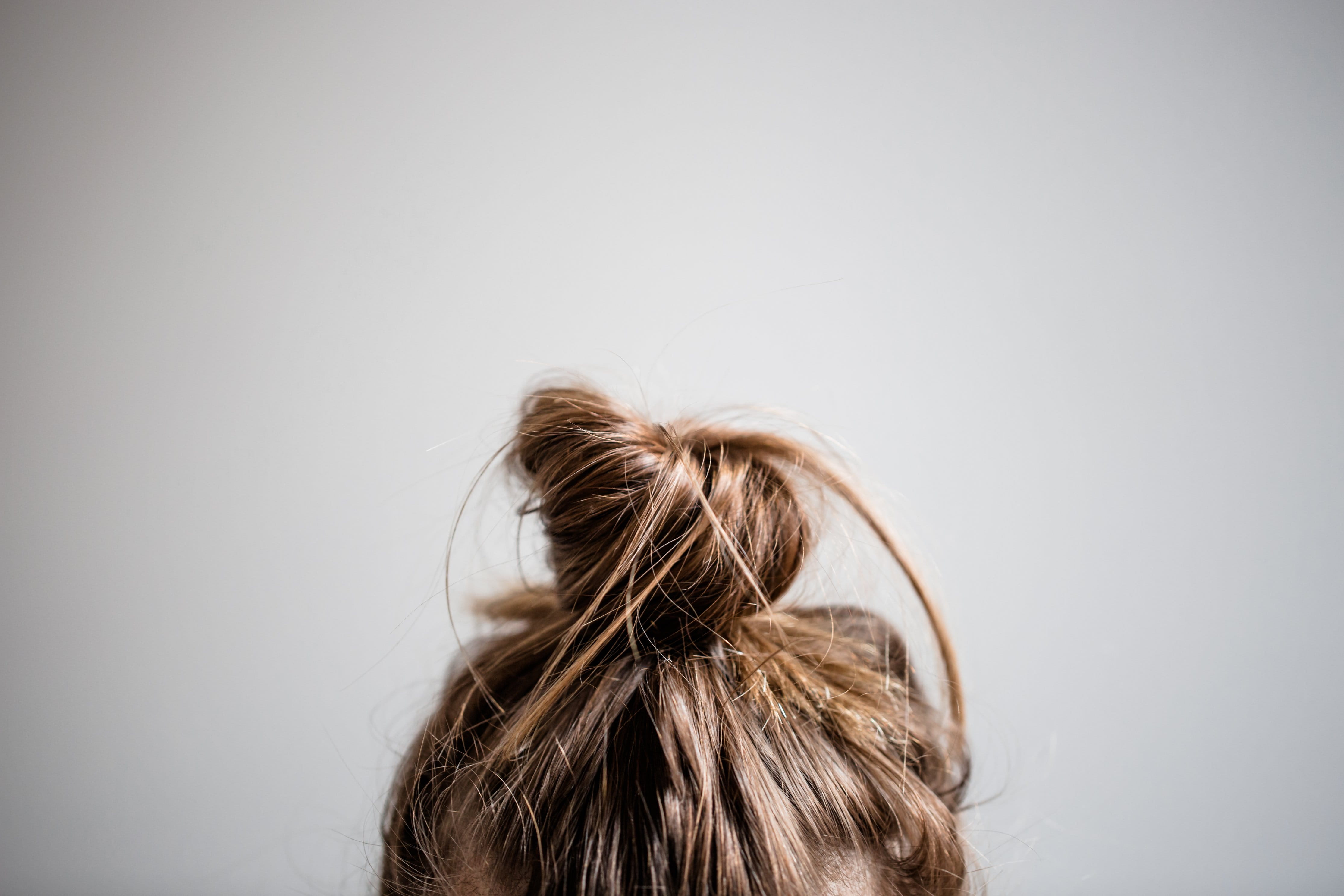 obscured face, adult, gray background, bun, long hair, human head, messy, copy space, Beauty, photo, Hair, one person, hairstyle, portrait, human hair, HD Wallpaper