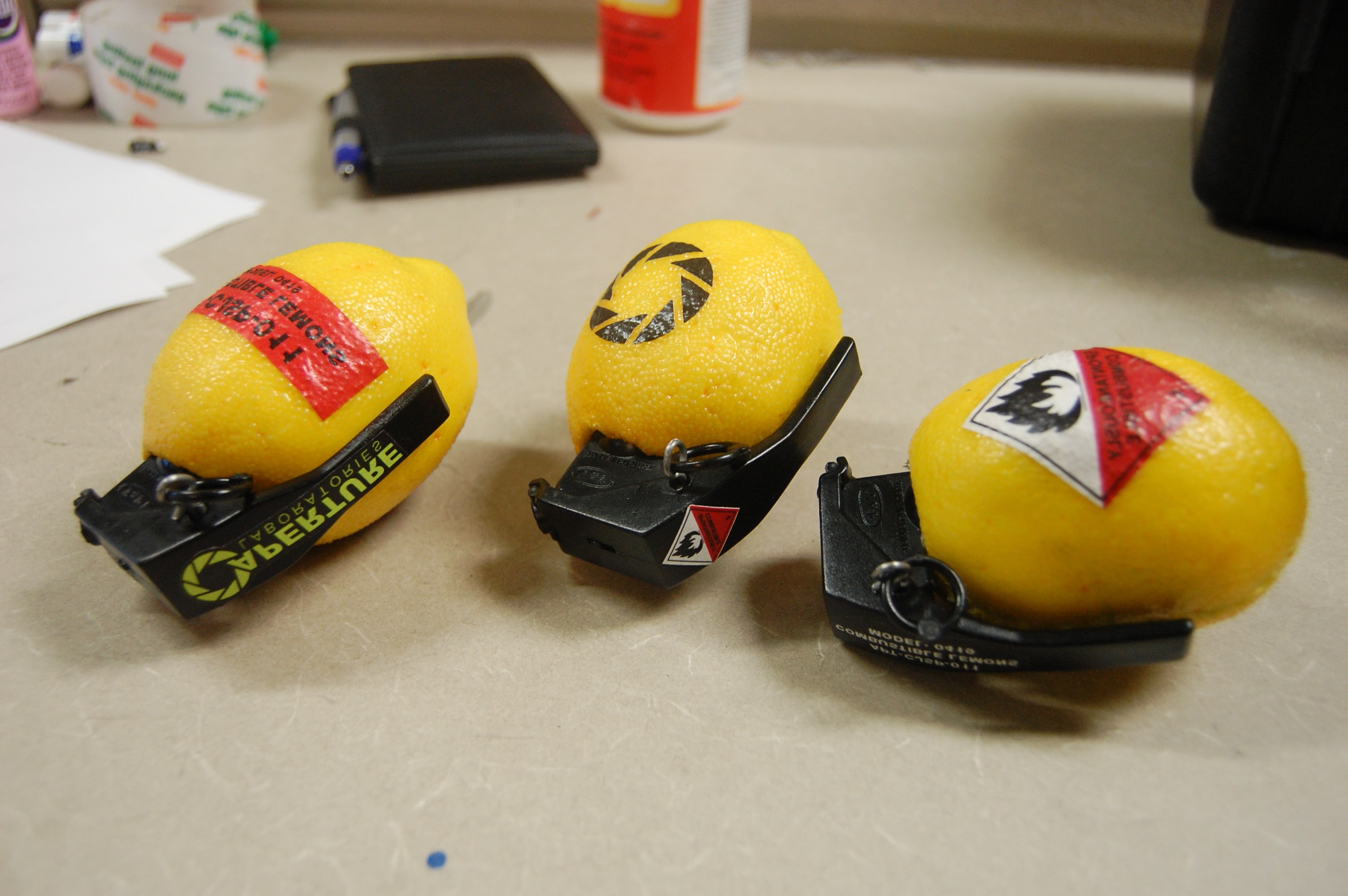 Lemons, wellbeing, Grenades, motor vehicle, fruit, food, still life, high angle view, citrus fruit, table, helmet, video games, 2K, Aperture Laboratories, HD Wallpaper