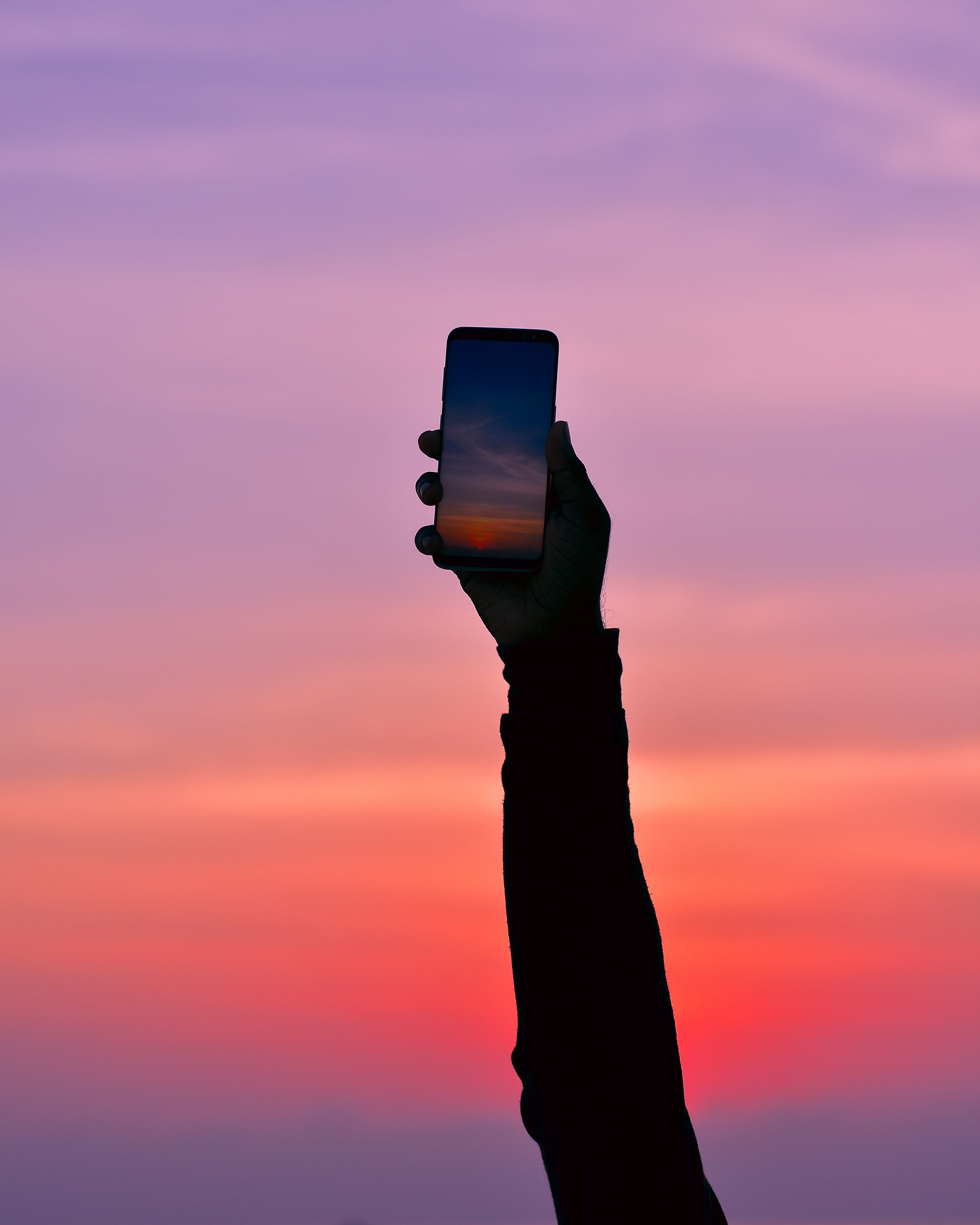 black, holding, tech, smartphone, body part, silhouette, sunset, midnight, communication, hand, 4K, smart phone, maldives, cloud - sky, human arm, pink color, Phone HD Wallpaper