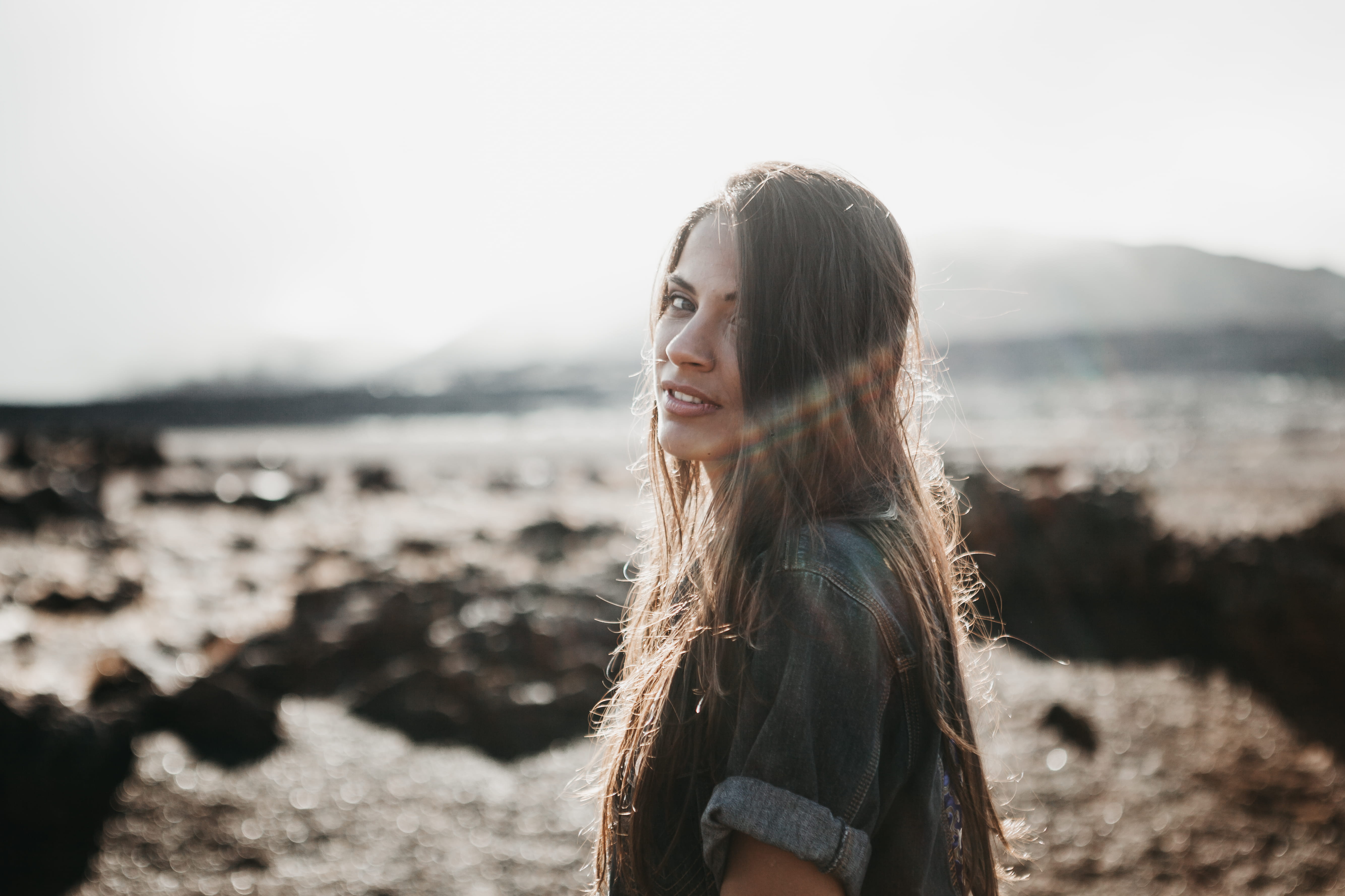 enjoyment, top, backlight, happiness, one Person, smiling, mature, bliss, portrait, rock - Object, grey, beach, cheerful, human Hair, beauty, young Adult, HD Wallpaper