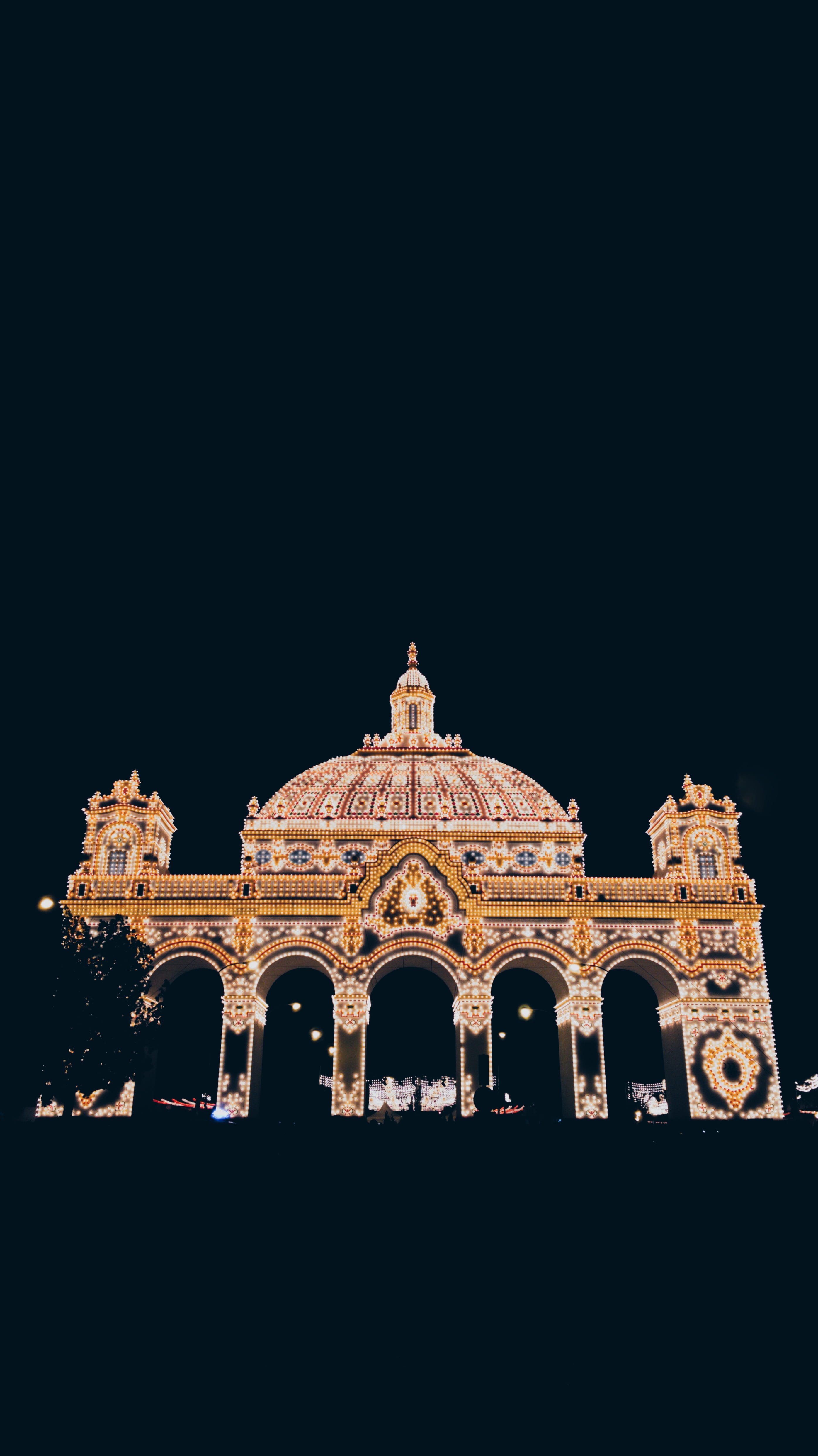 night, outdoors, worship, city, monument, clear sky, housing, low angle view, sky, building exterior, nature, built structure, lights, feria de abril, travel, Phone HD Wallpaper