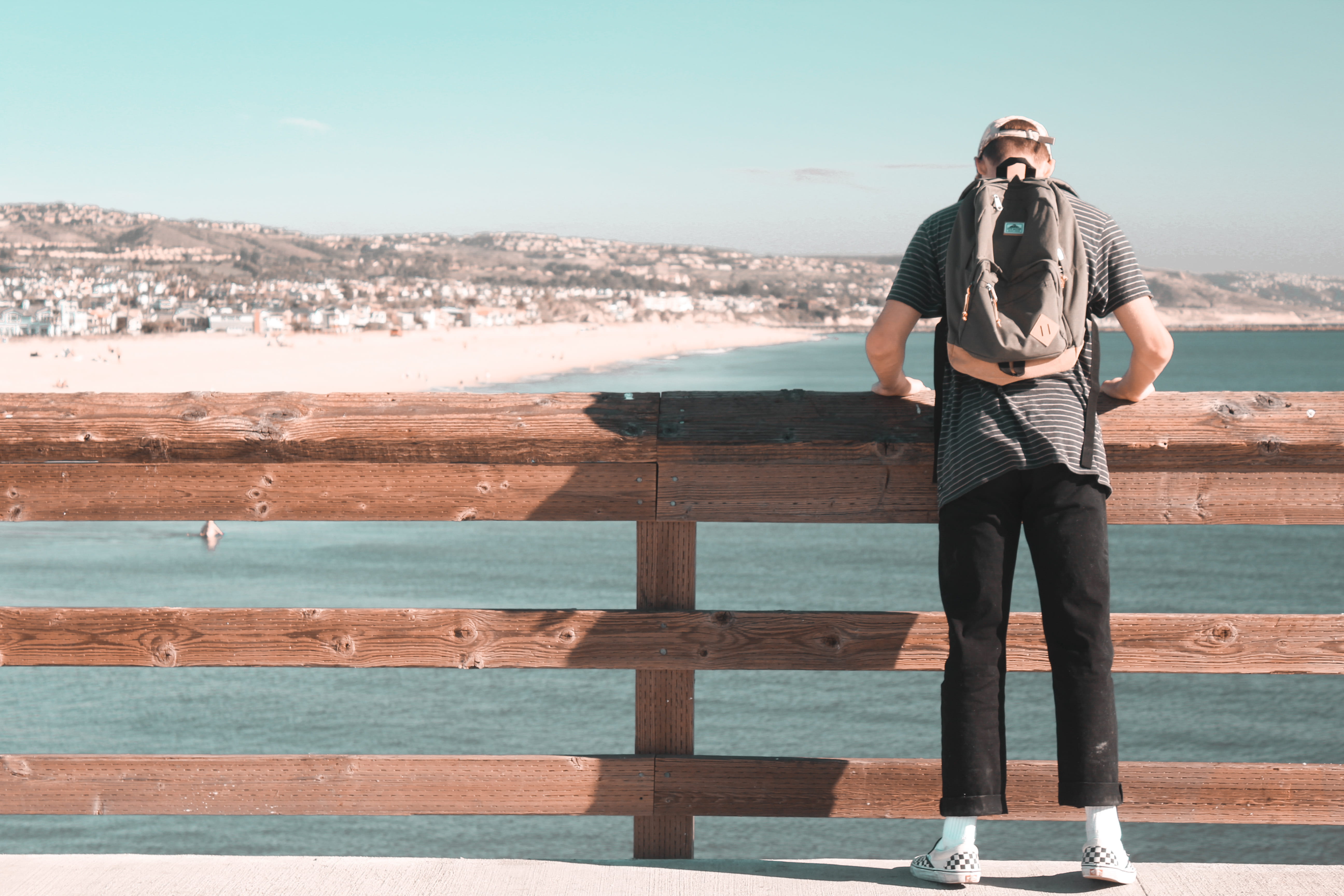 city, person, day, young adult, sunlight, beauty in nature, full length, outdoors, men, sun, backpack, town, surfing, traveling, beautiful, ocean, water, HD Wallpaper