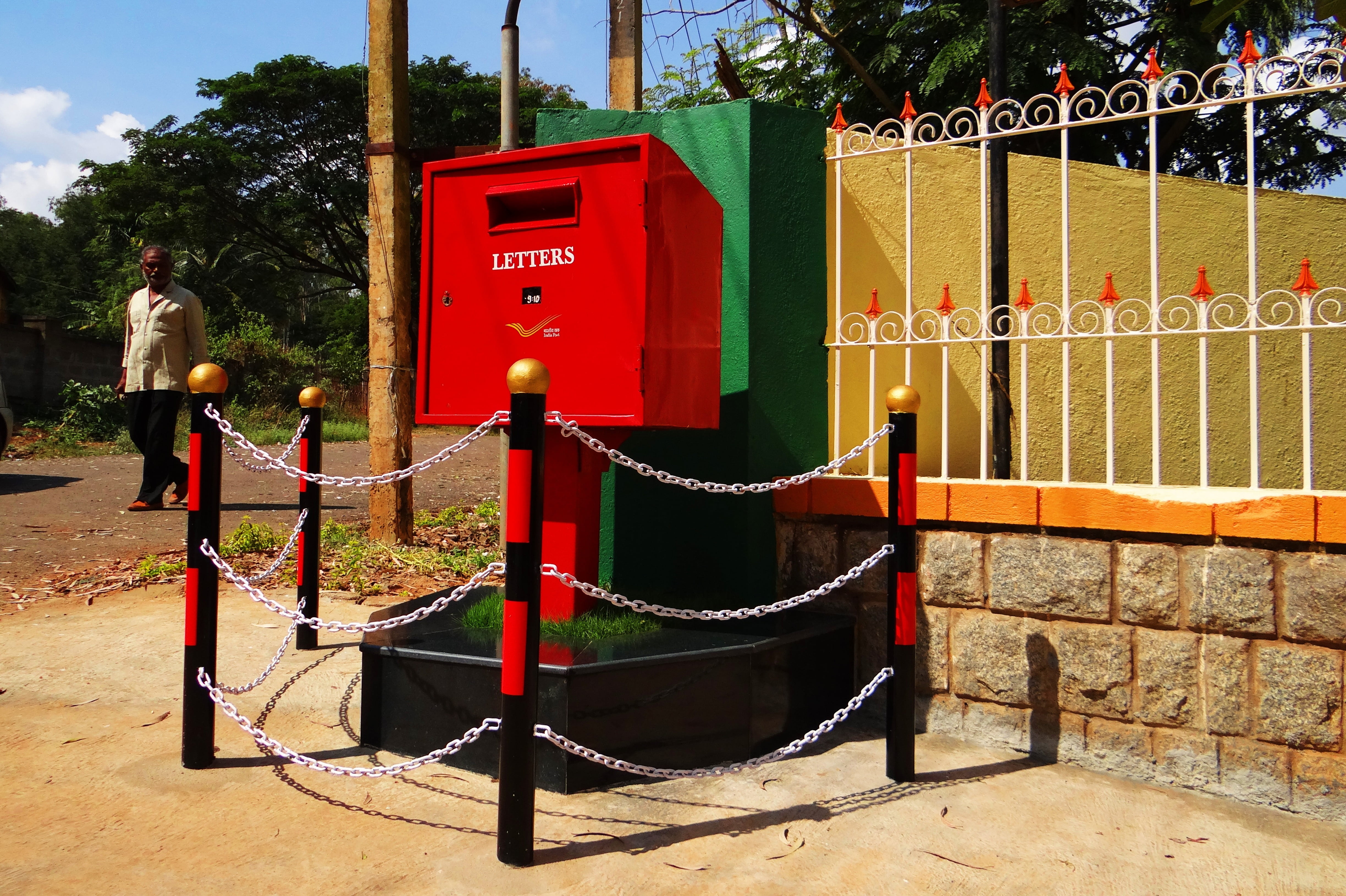 one person, 4K, security, fence, tv type, building exterior, full length, barrier, man, built structure, day, nature, sunlight, red, protection, dharwad, HD Wallpaper