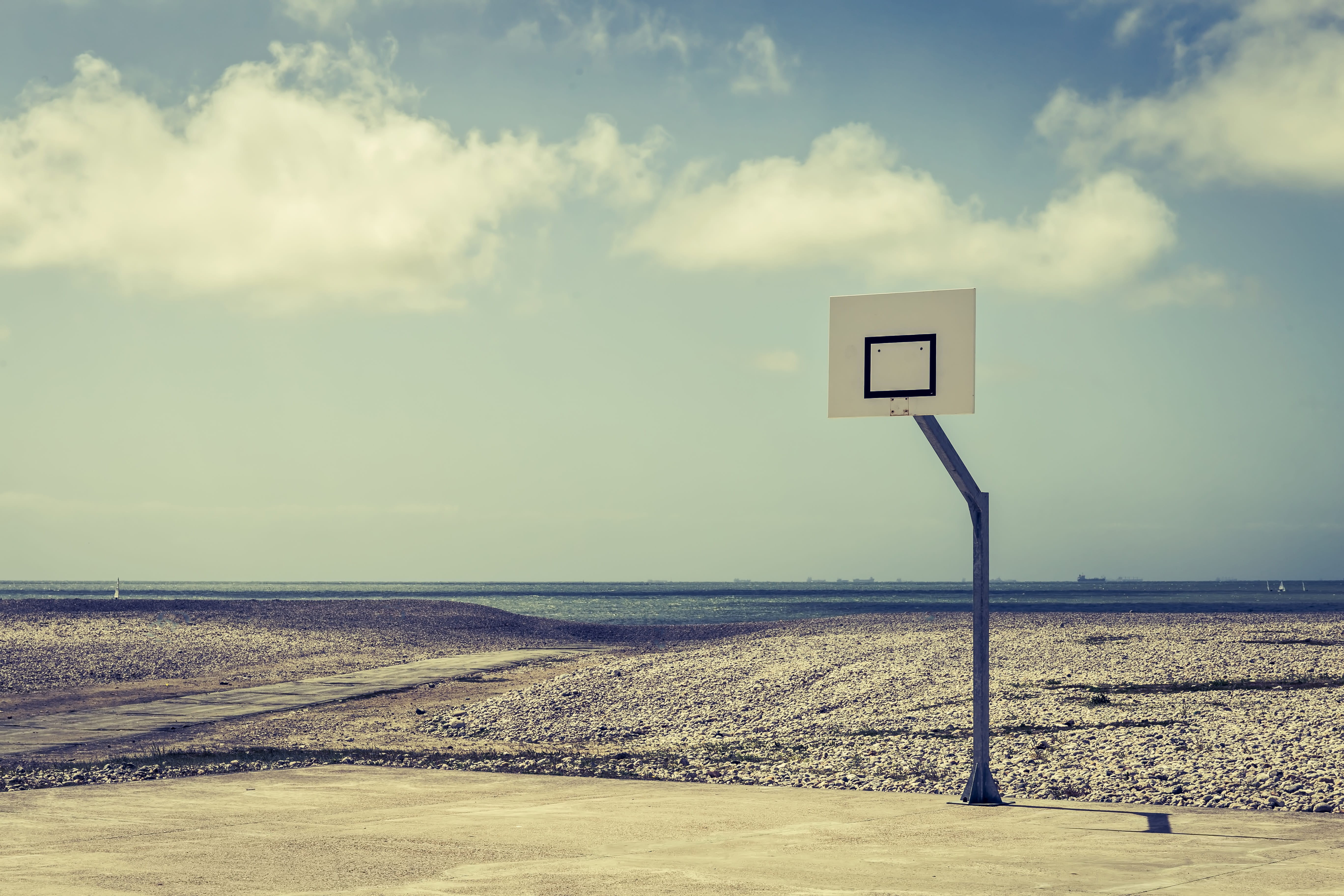beauty in nature, outdoors, daytime, sunlight, day, scenics - nature, field, cloud - sky, horizon, beach, black, coastline, water, tranquility, empty, basketball, HD Wallpaper