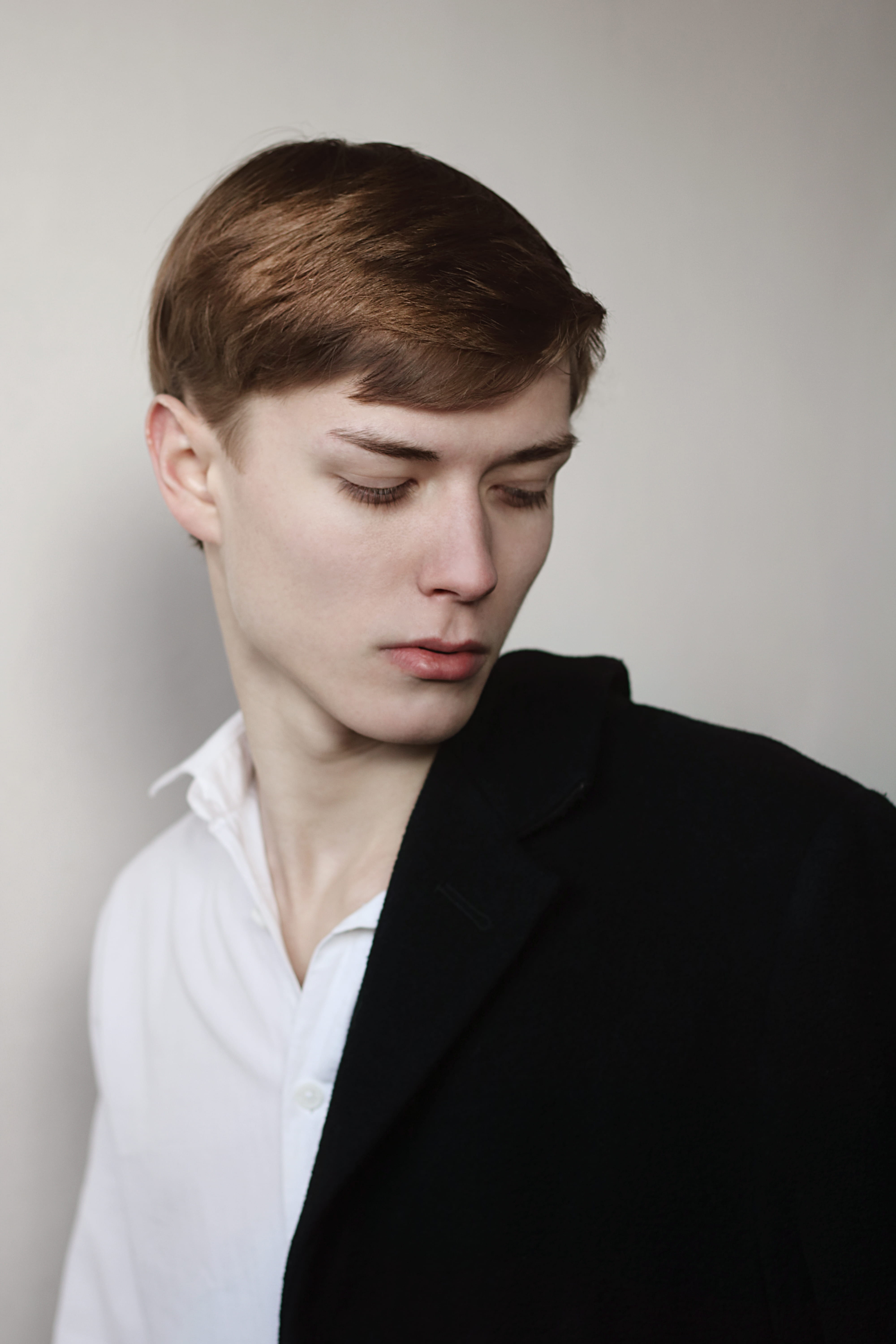 serious, headshot, looking down, wearing, 5K, design, young, elegance, boy, coat, brown hair, person, black, hairstyle, jacket, one person, man, looking, Phone HD Wallpaper
