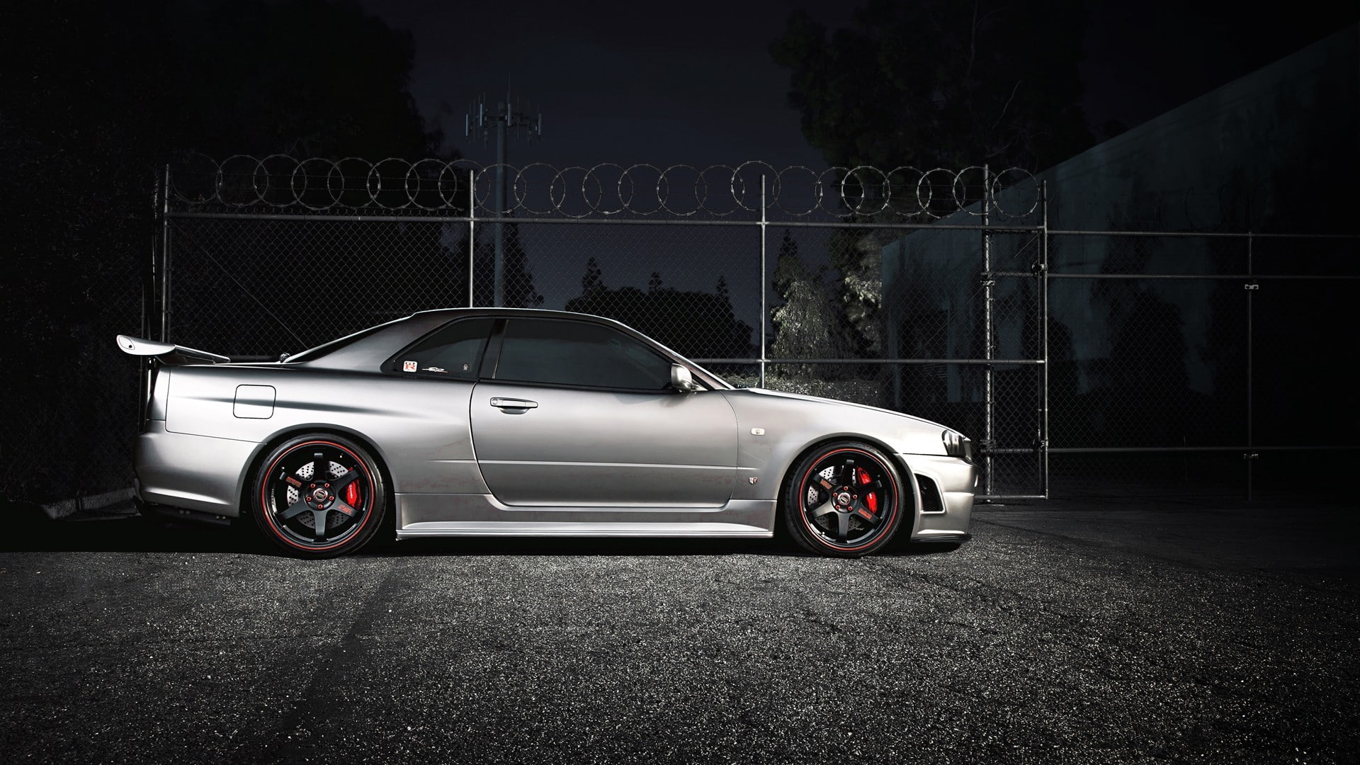 Nissan Skyline GT-R R34, wheel, wealth, safety, tree, outdoors, security, street, luxury, silver colored, car, transportation, road, shiny, city, protection, HD Wallpaper