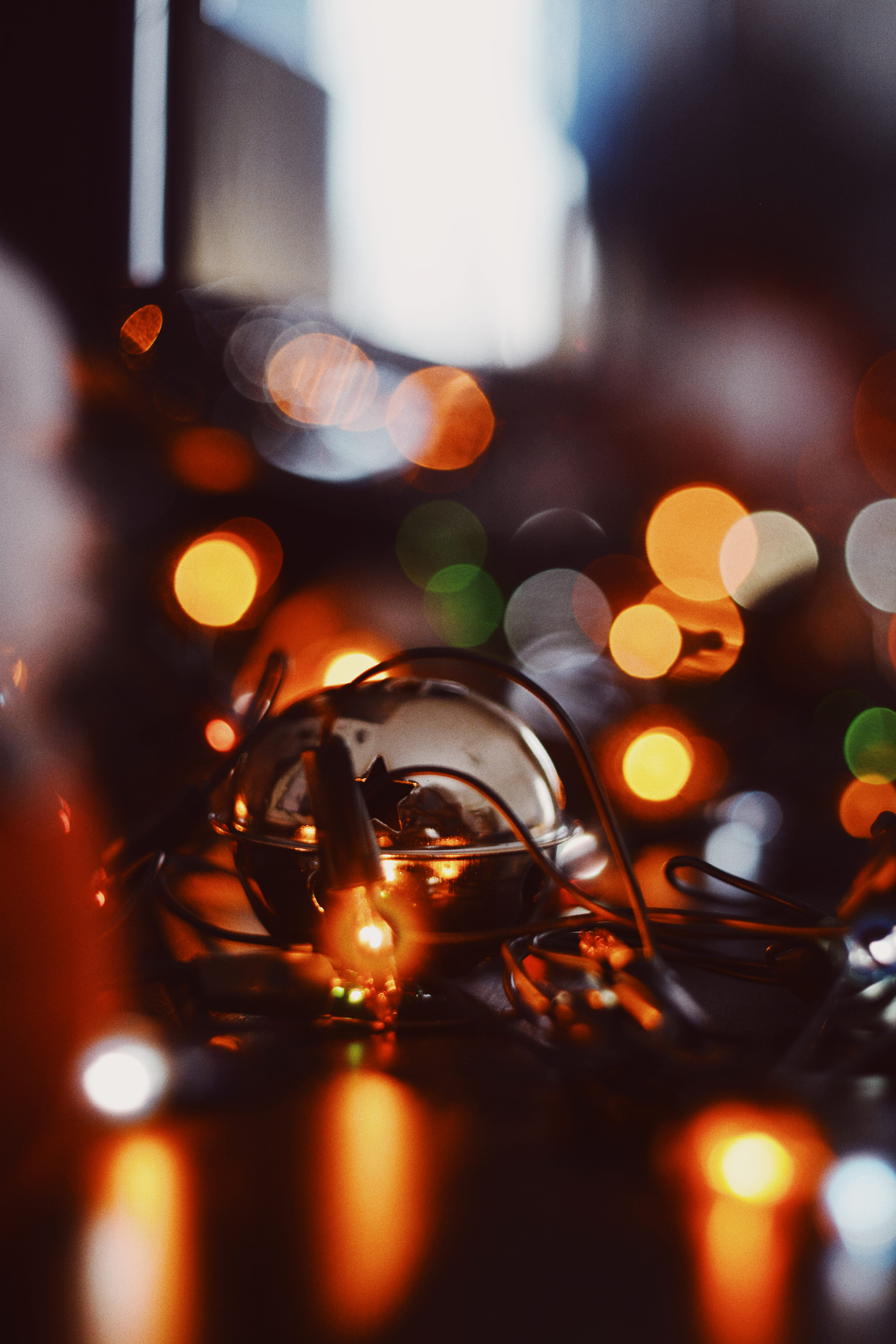  crystal, glow, christmas lights, selective focus, glass, defocused, black, glass - material, surface, drink, tarmac, asphalt, lights, lighting, Phone HD Wallpaper