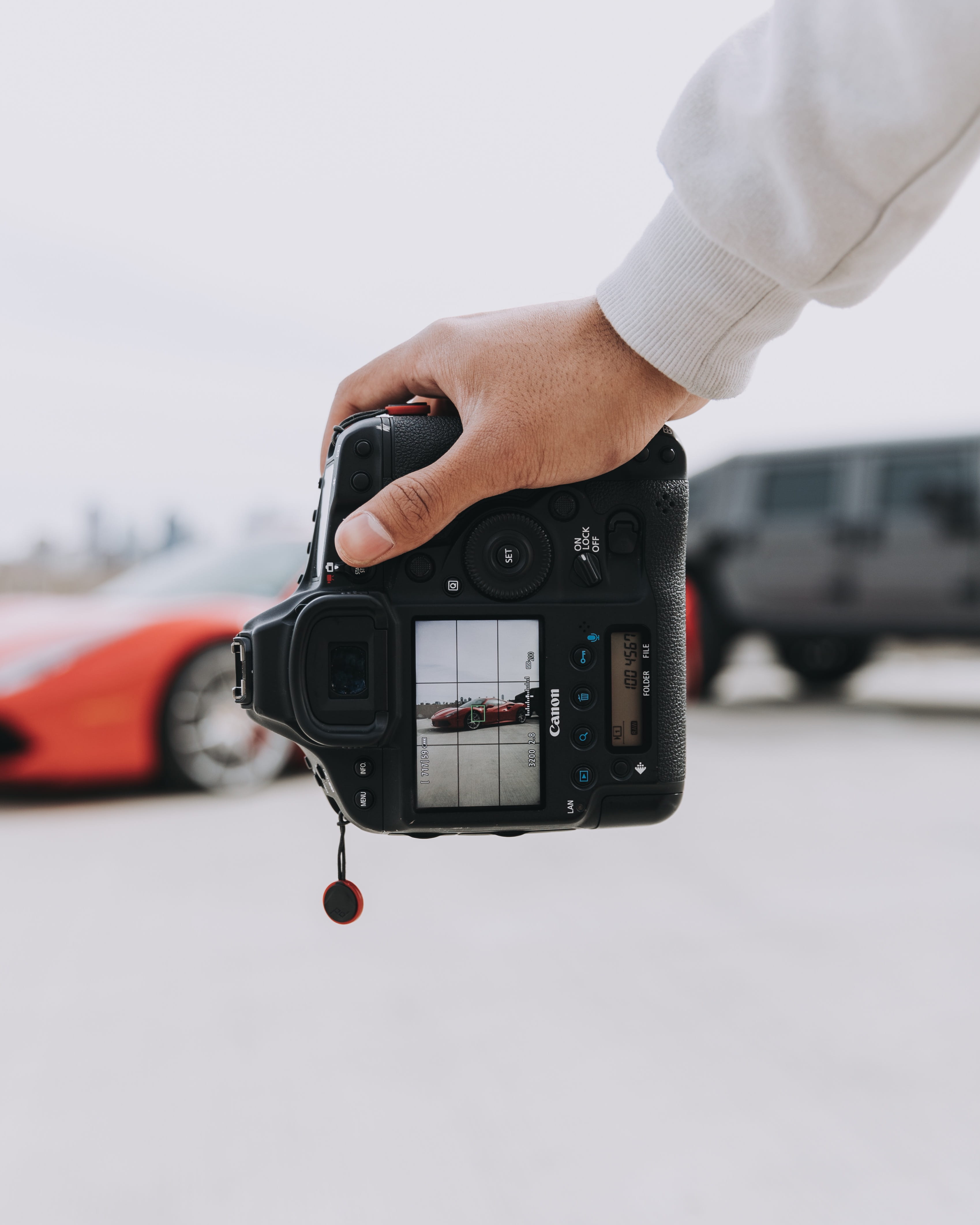 person, focus on foreground, hand, outdoors, photography themes, sky, photographic equipment, digital camera, day, wheel, mode of transportation, close-up, Phone HD Wallpaper