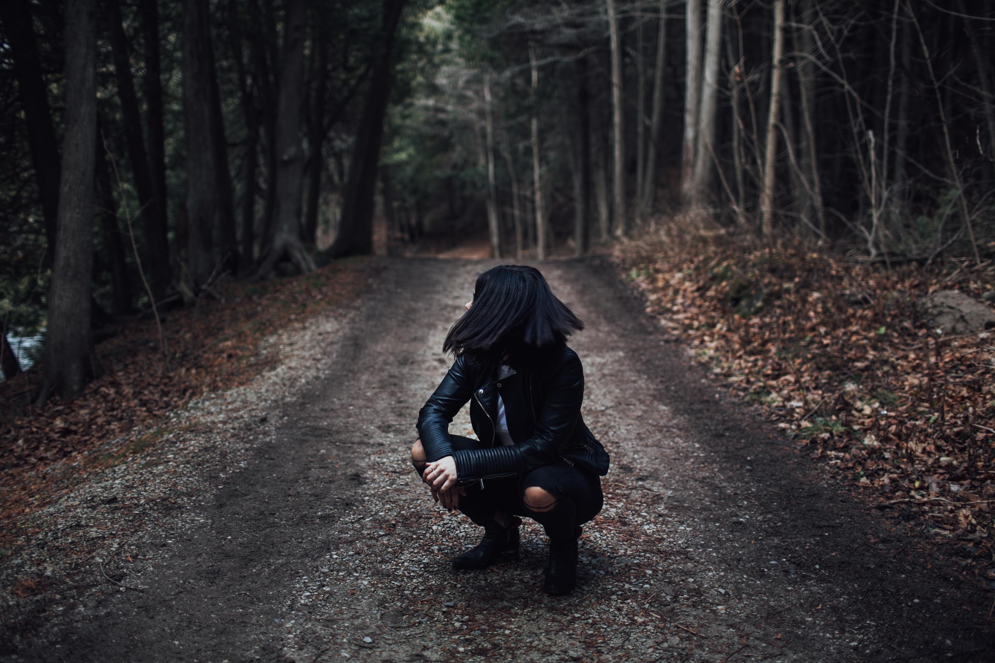 loneliness, adult, dirt, nature, road, depression - sadness, woodland, plant, real people, black leather jacket, daytime, women, hood - clothing, road between, HD Wallpaper