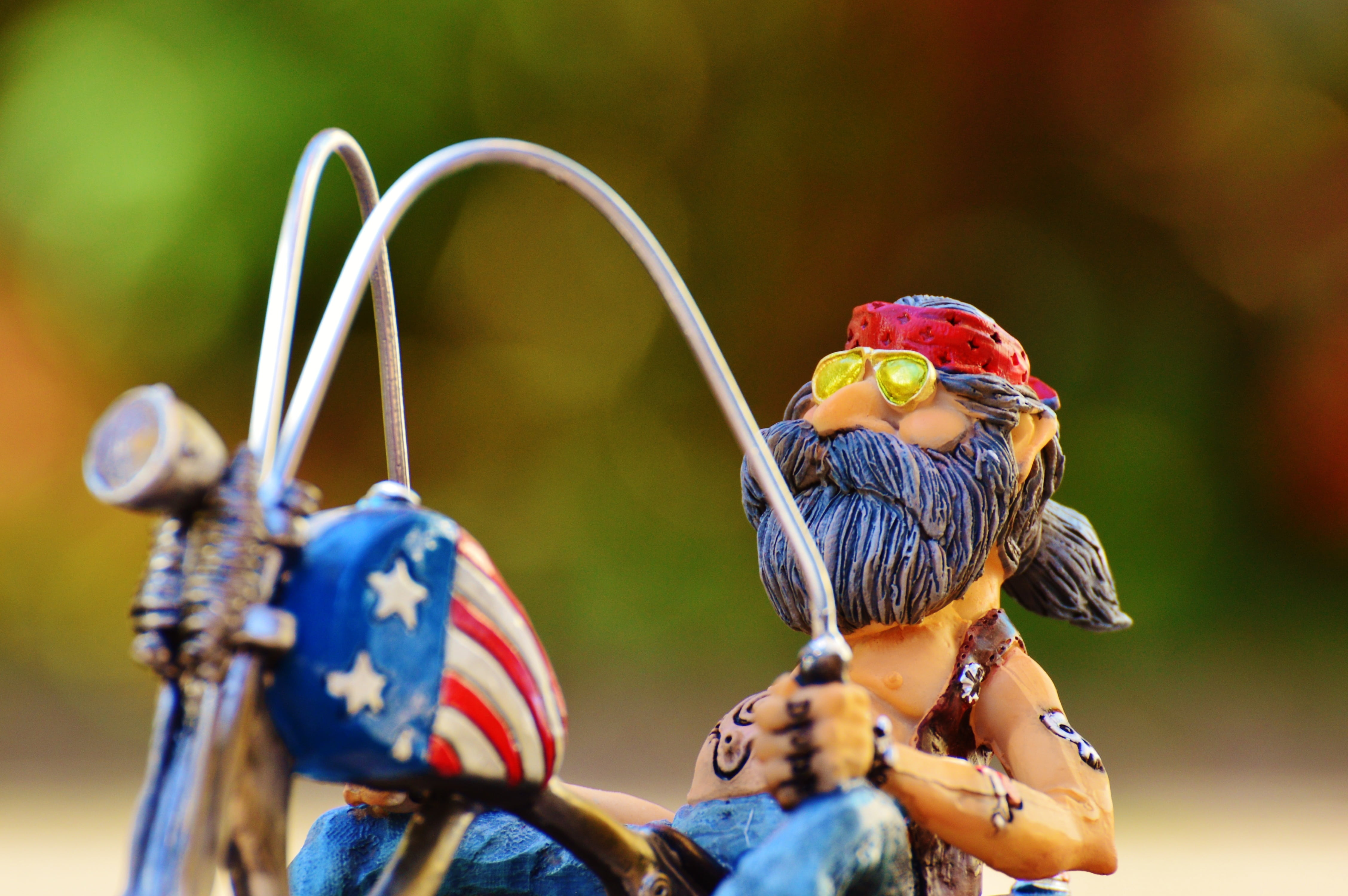 headband, 4K, toy, cool, creativity, fun, day, art and craft, figure, funny, tattooed, close-up, outdoors, bike, focus on foreground, america, joy of life, HD Wallpaper