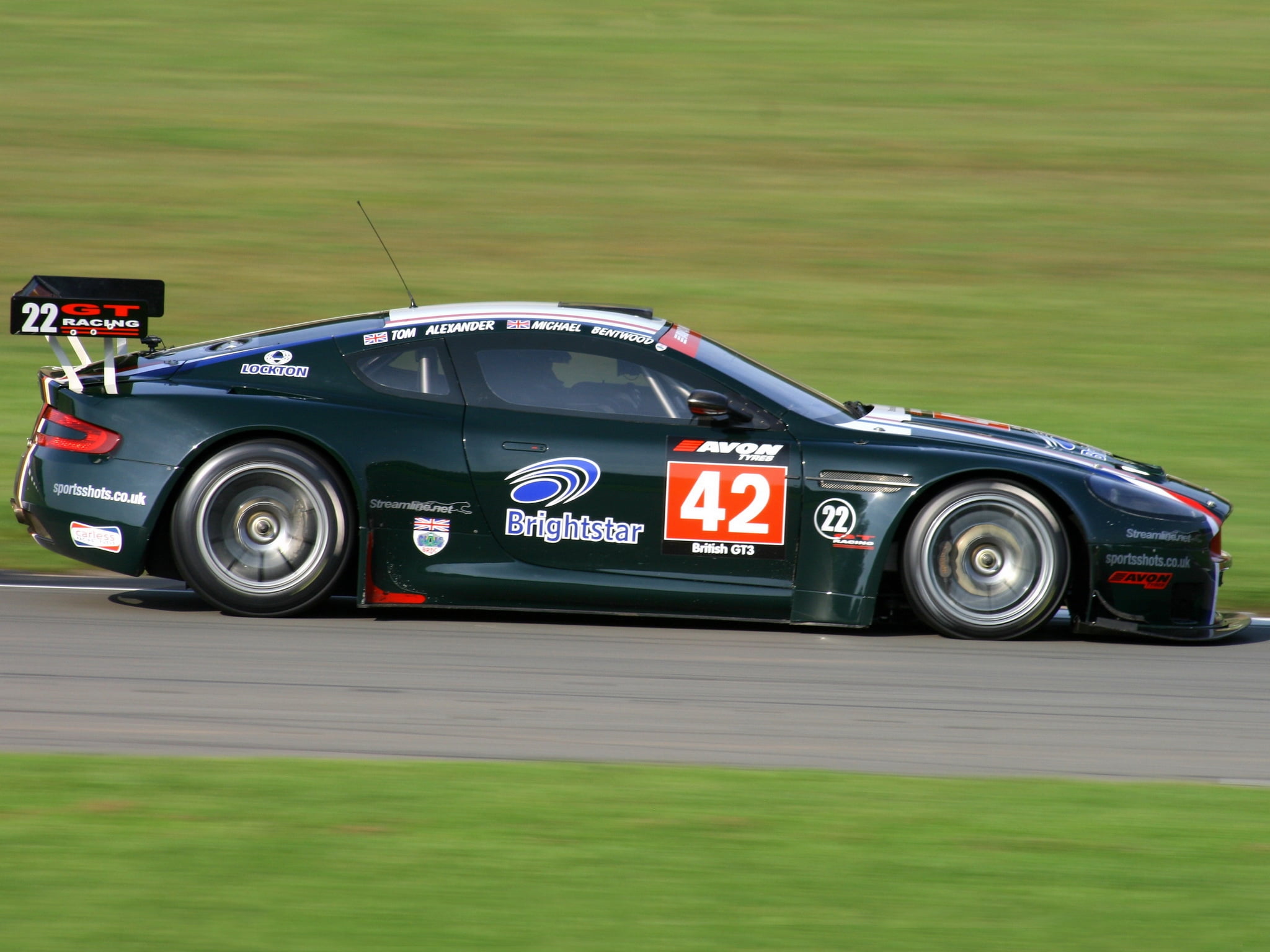 sports, excitement, cars, 1080P, blurred motion, professional sport, black, grass, motion, montmelo , piano Tuner, side View, sport, speed, aston martin, HD Wallpaper