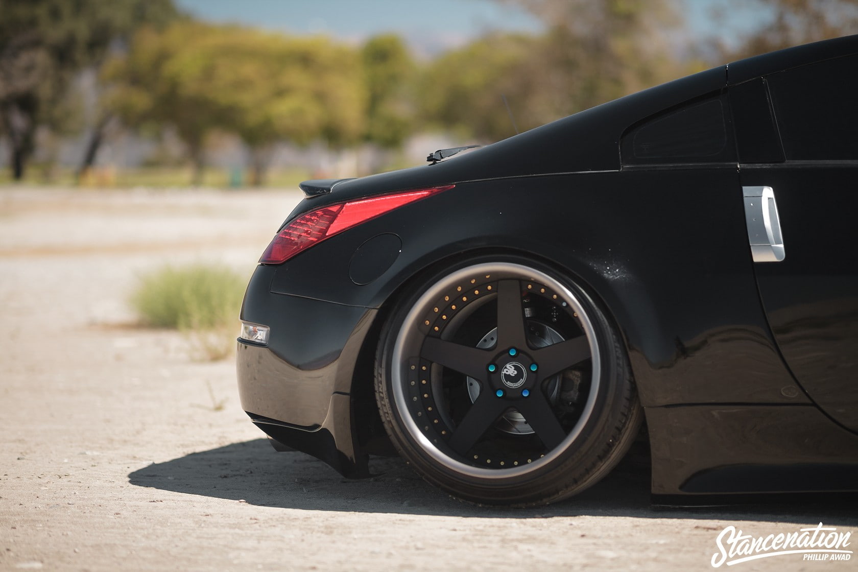 black color, car, focus on foreground, sunlight, outdoors, stationary, day, nature, road, transportation, wheel, land vehicle, tire, close-up, luxury, no people, HD Wallpaper