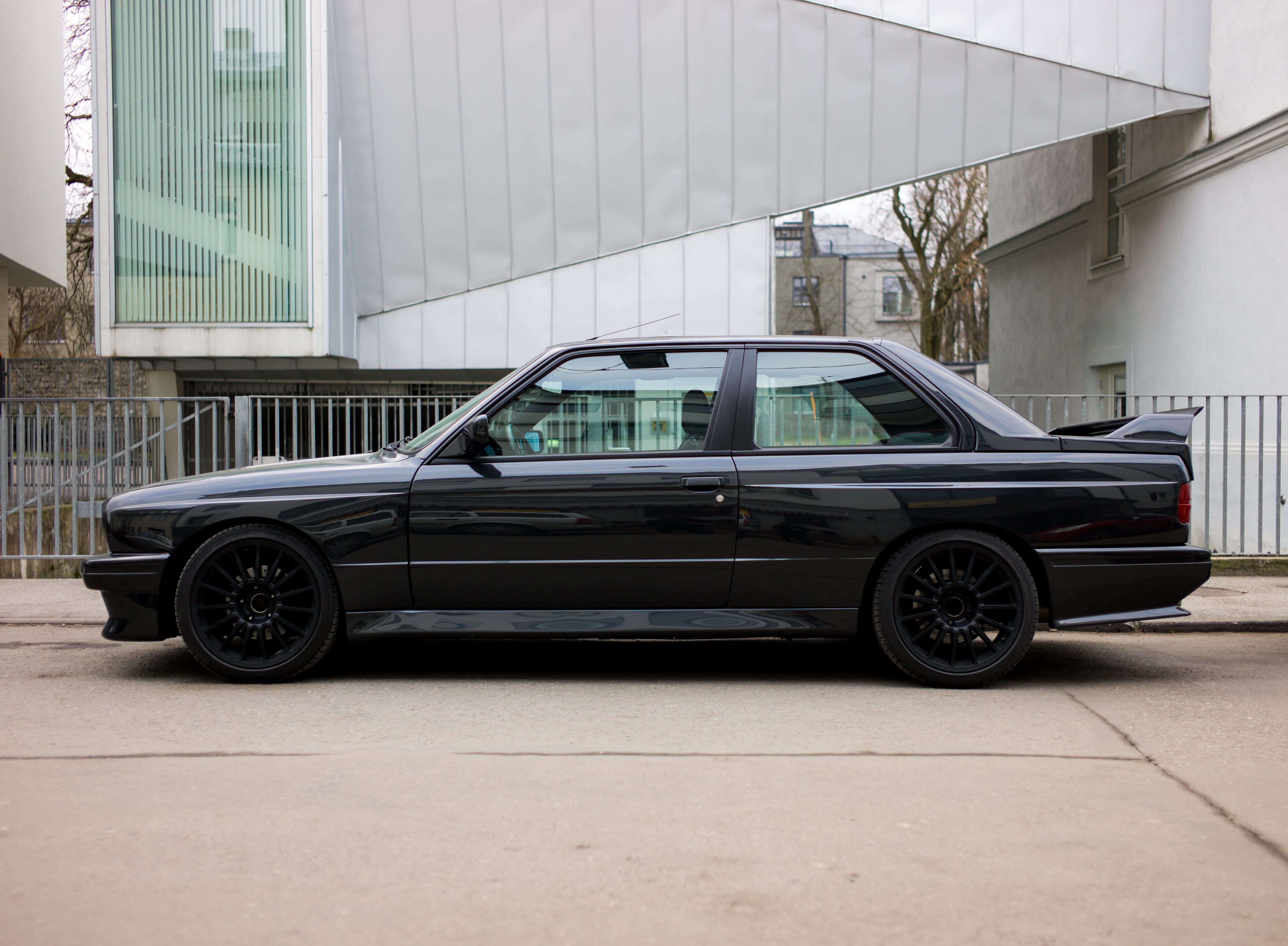 street, modern, black coupé, no people, city, estonia, parking, stationary, auto, metal wall, transportation, outdoors, car, silver building, black wheels, HD Wallpaper