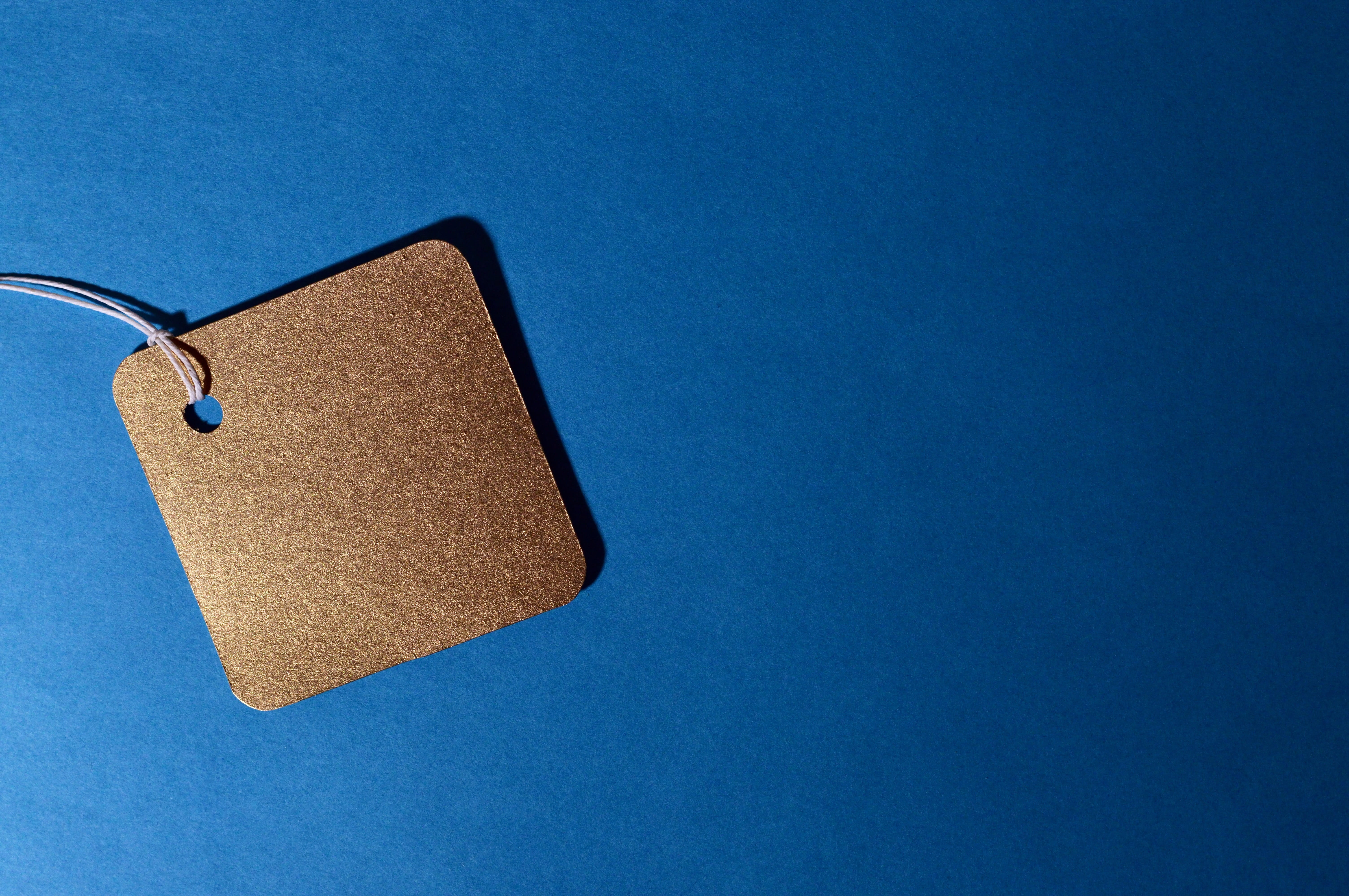 gold, clothing, colored background, sell, personal accessory, heart shape, prices, blue background, discount, directly above, paperboard, no people, table, HD Wallpaper