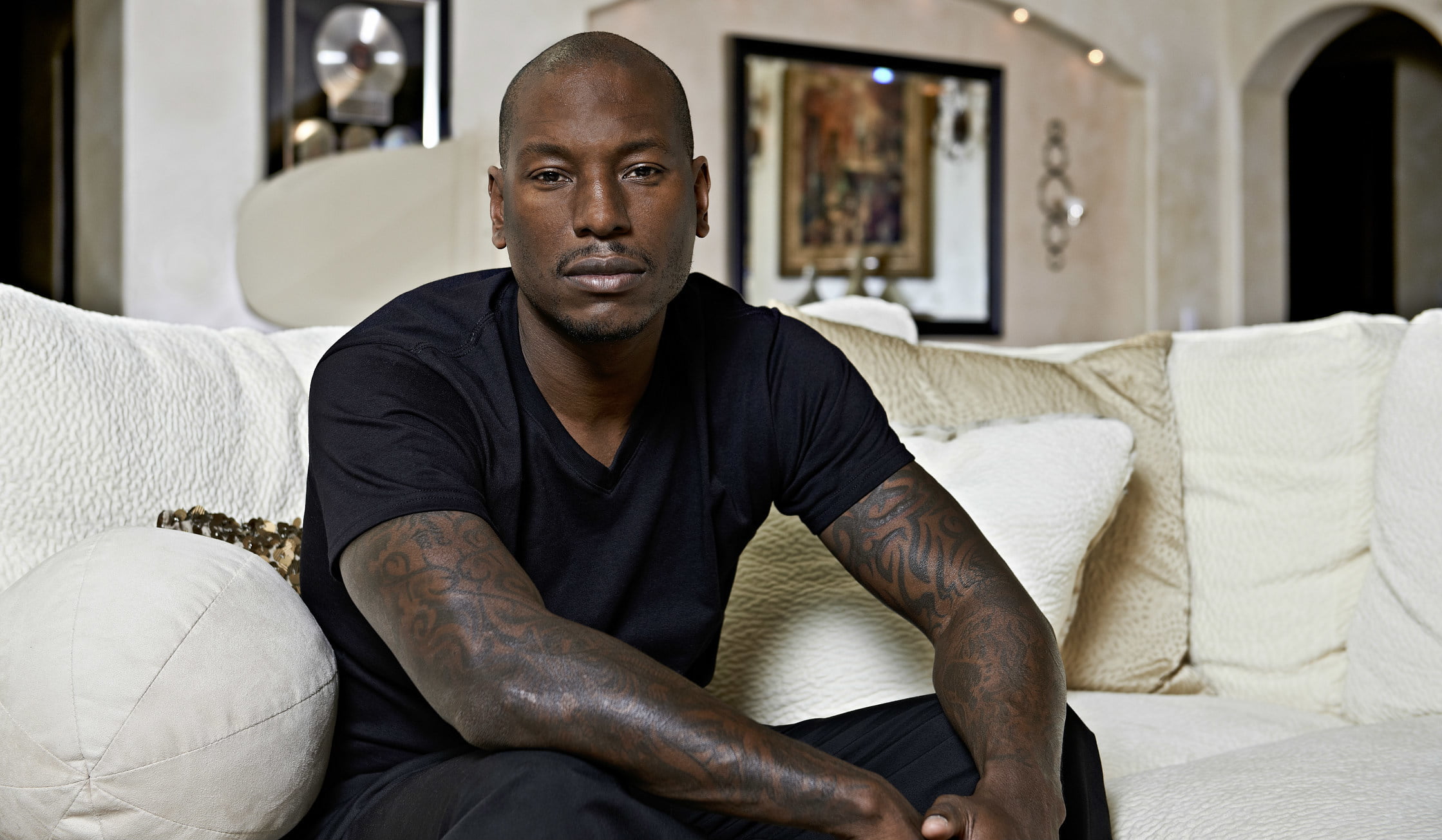 living room, contemplation, front view, black, tattoo, sofa, confidence, portrait, males, neck, shirt, real people, actor, lifestyles, one person, indoors, HD Wallpaper