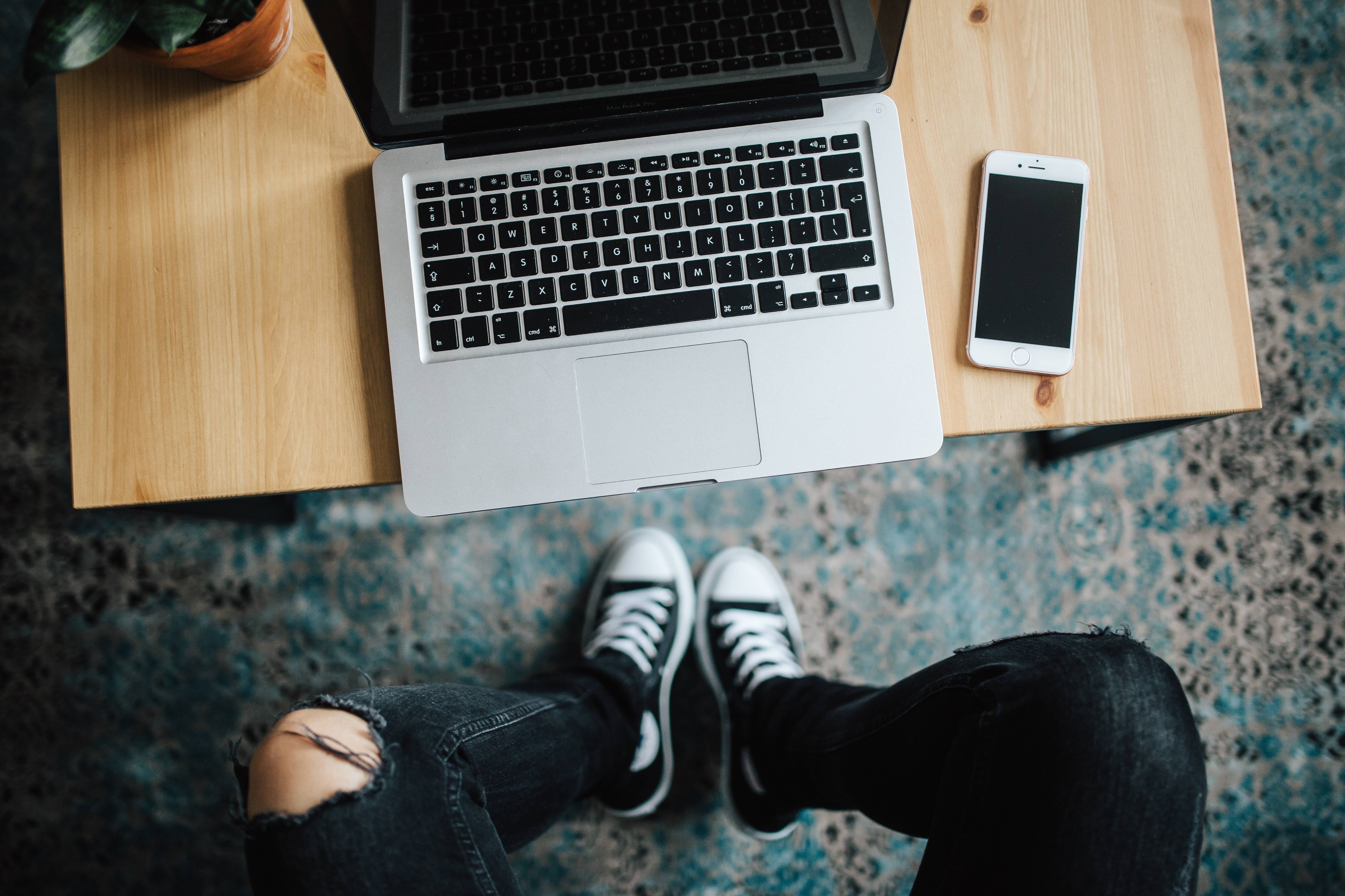 one Person, computer equipment, shoe, wooden, black, men, communication, sneakers, using laptop, low section, 5K, all star, Apple, trousers, business, HD Wallpaper