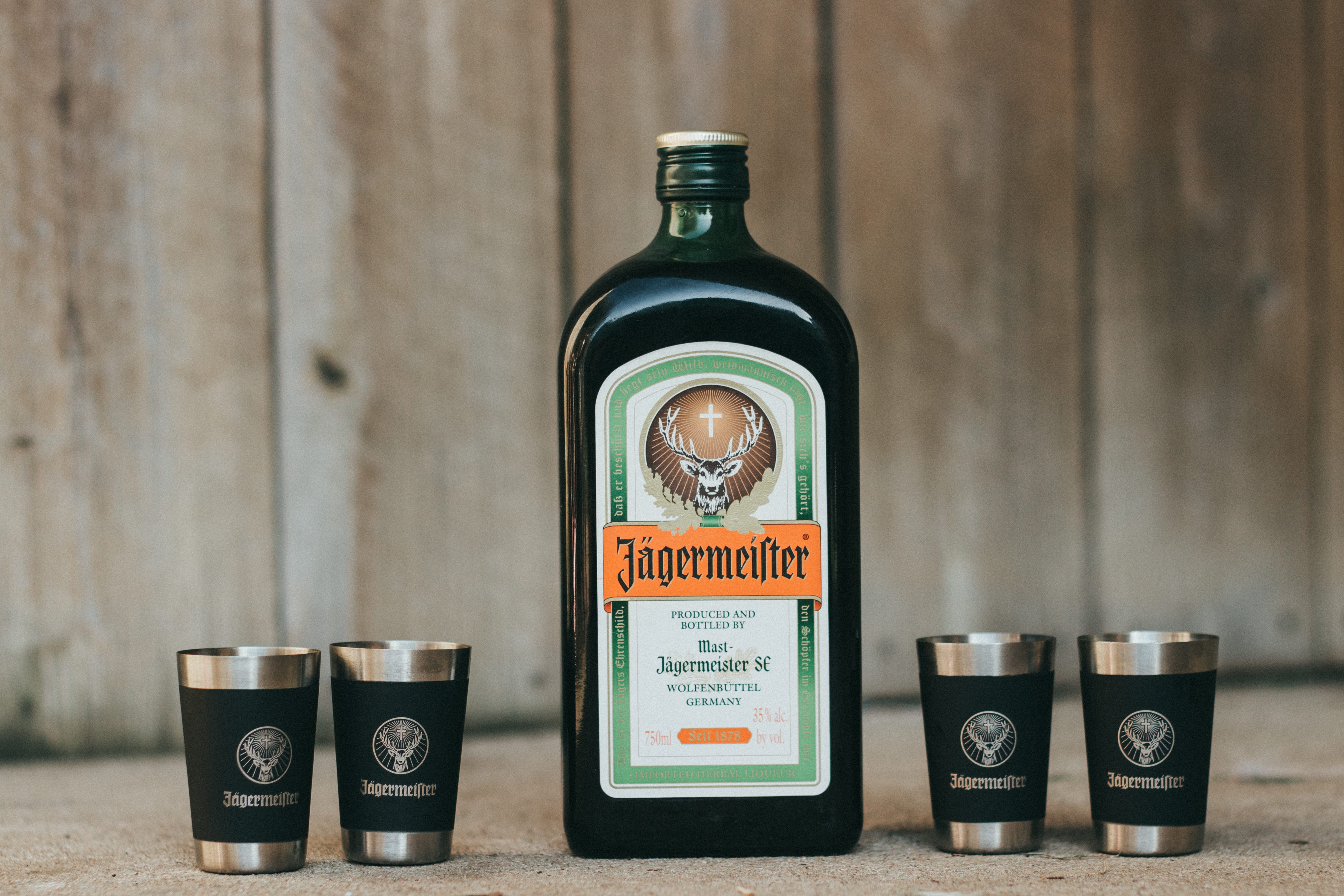 western script, liquor, refreshment, no people, drinking, stainless, indoors, cylinder, drink, 4K, black, shot glass, container, white, jagermeister, cups, HD Wallpaper