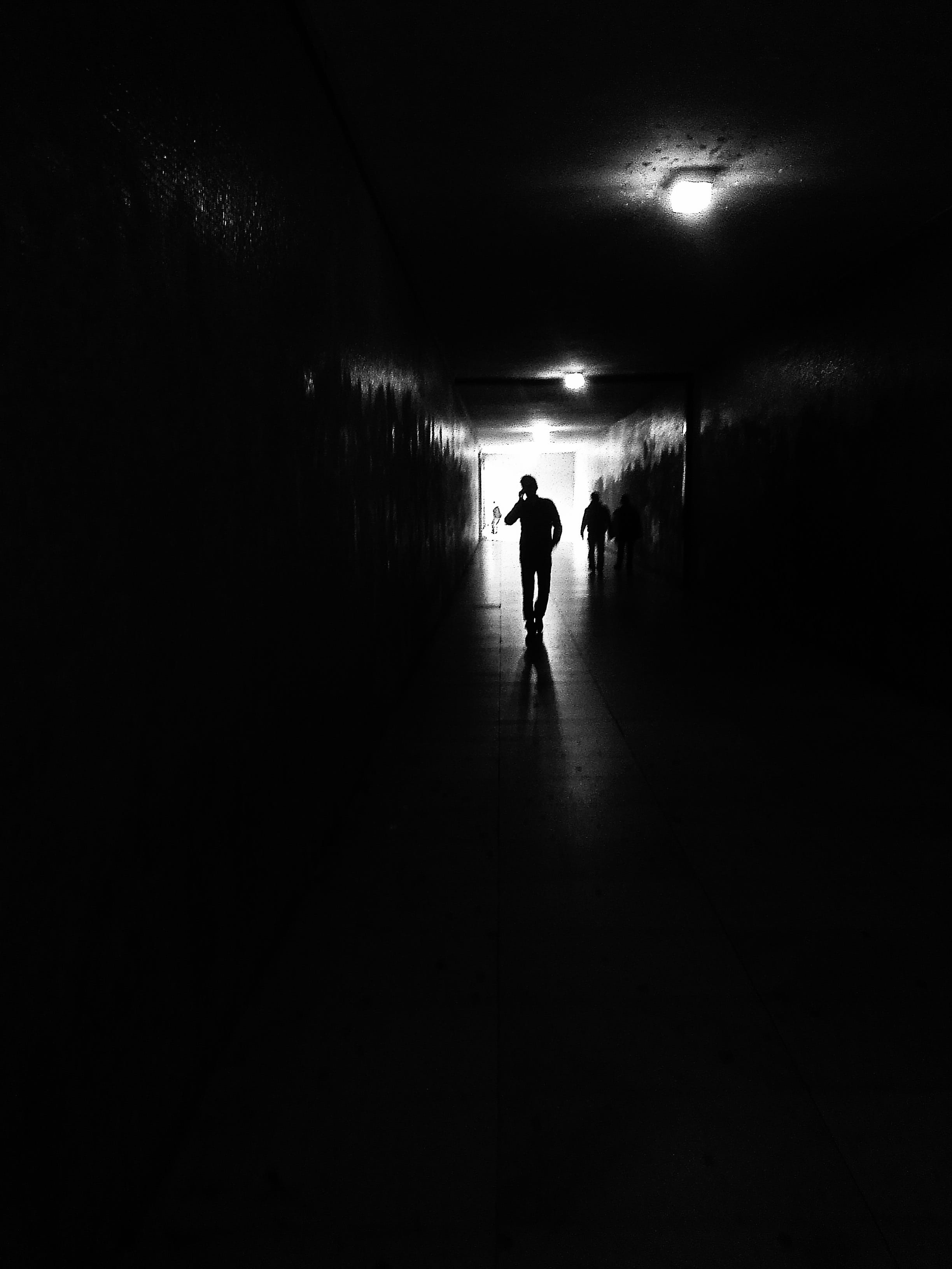 light - natural phenomenon, black and white, light, black-and-white, monochrome, basement, illuminated, passage, reflection, real people, inside, the way forward, Phone HD Wallpaper
