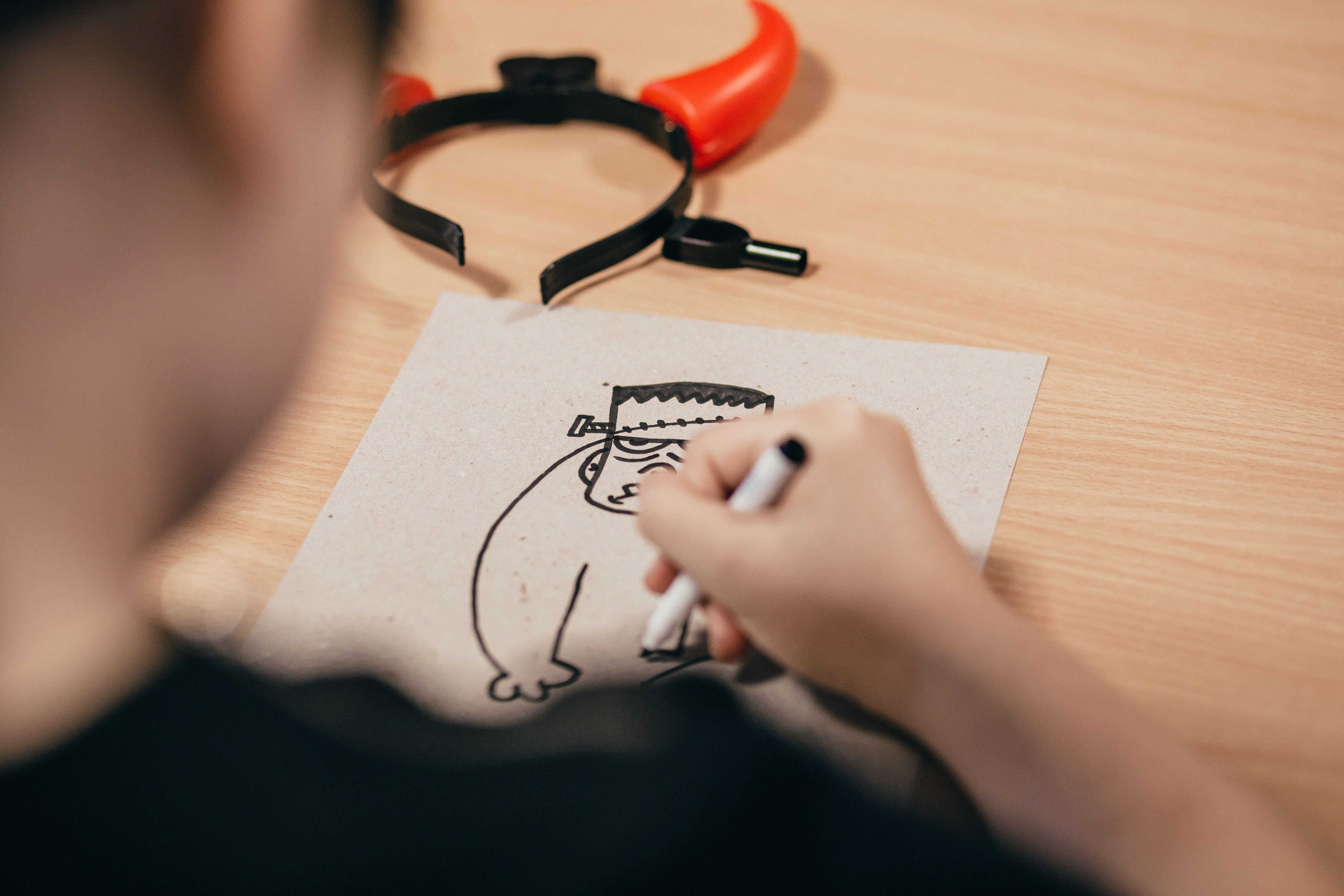 skill, child, holding, writing, desk, close-up, cartoon, over the shoulder view, creativity, 5K, devil, design professional, art, occupation, hand, holiday, HD Wallpaper