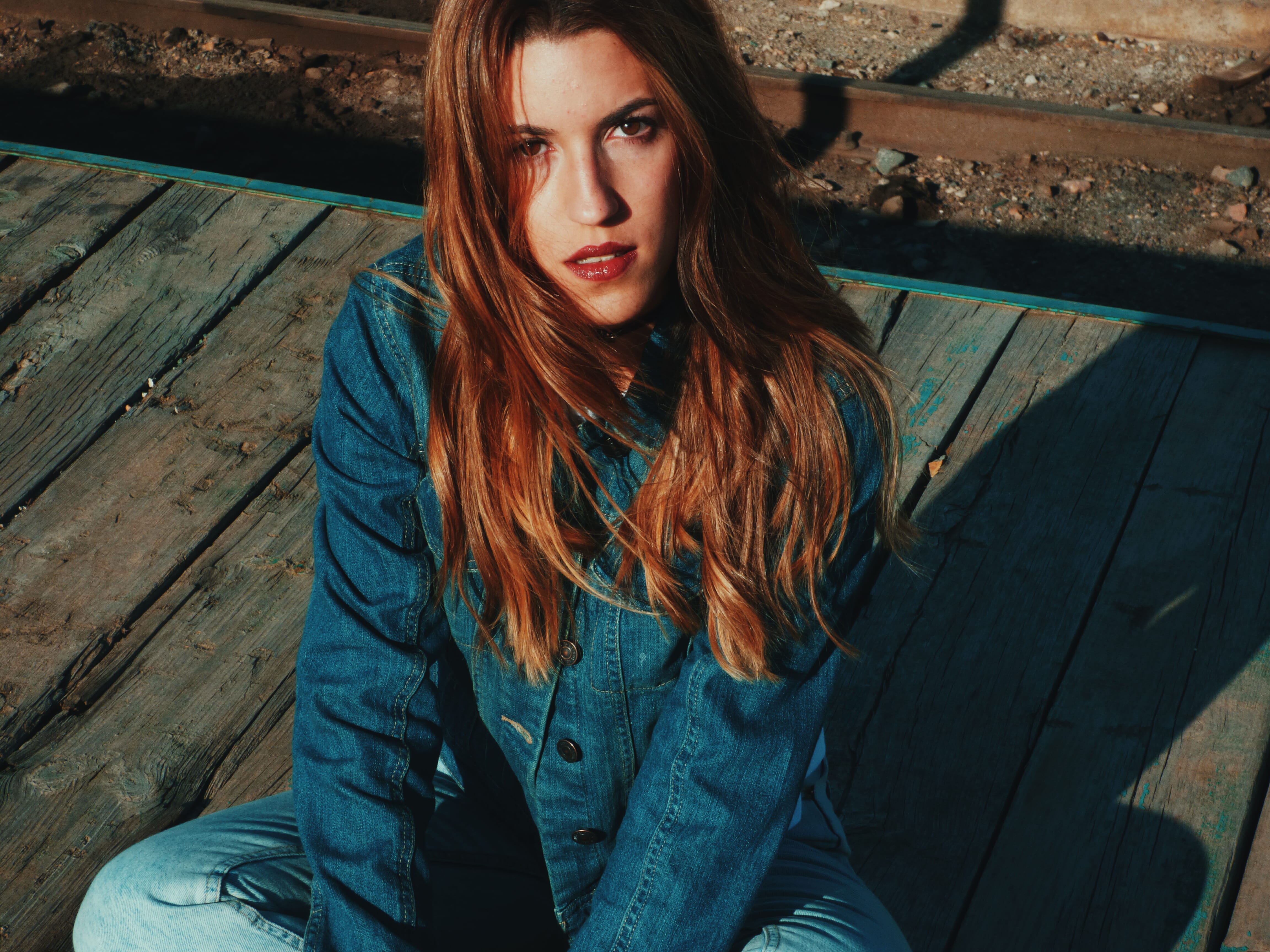 high angle view, adult, chambray, looking at camera, floor, lifestyles, hair, beauty, Eyes, human Face, outdoors, legged, brunette, sadness, woman, beautiful woman, HD Wallpaper