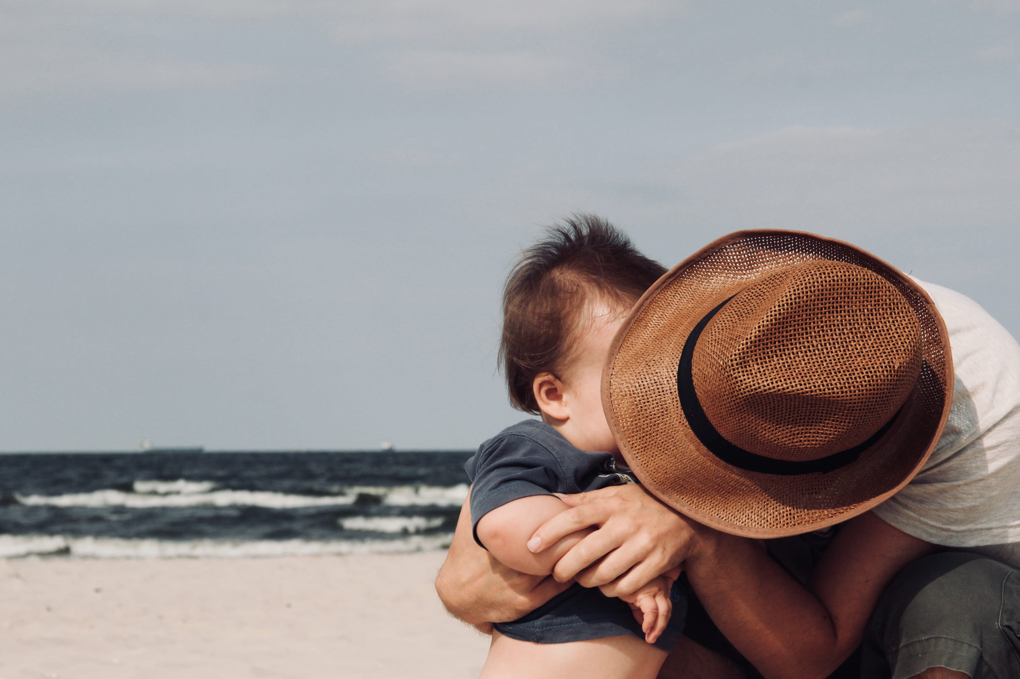 father, babyhood, hug, daddy, water, parenthood, waves, young, childhood, man, person, real people, casual clothing, child, sea, love, boys, people, hugging, HD Wallpaper