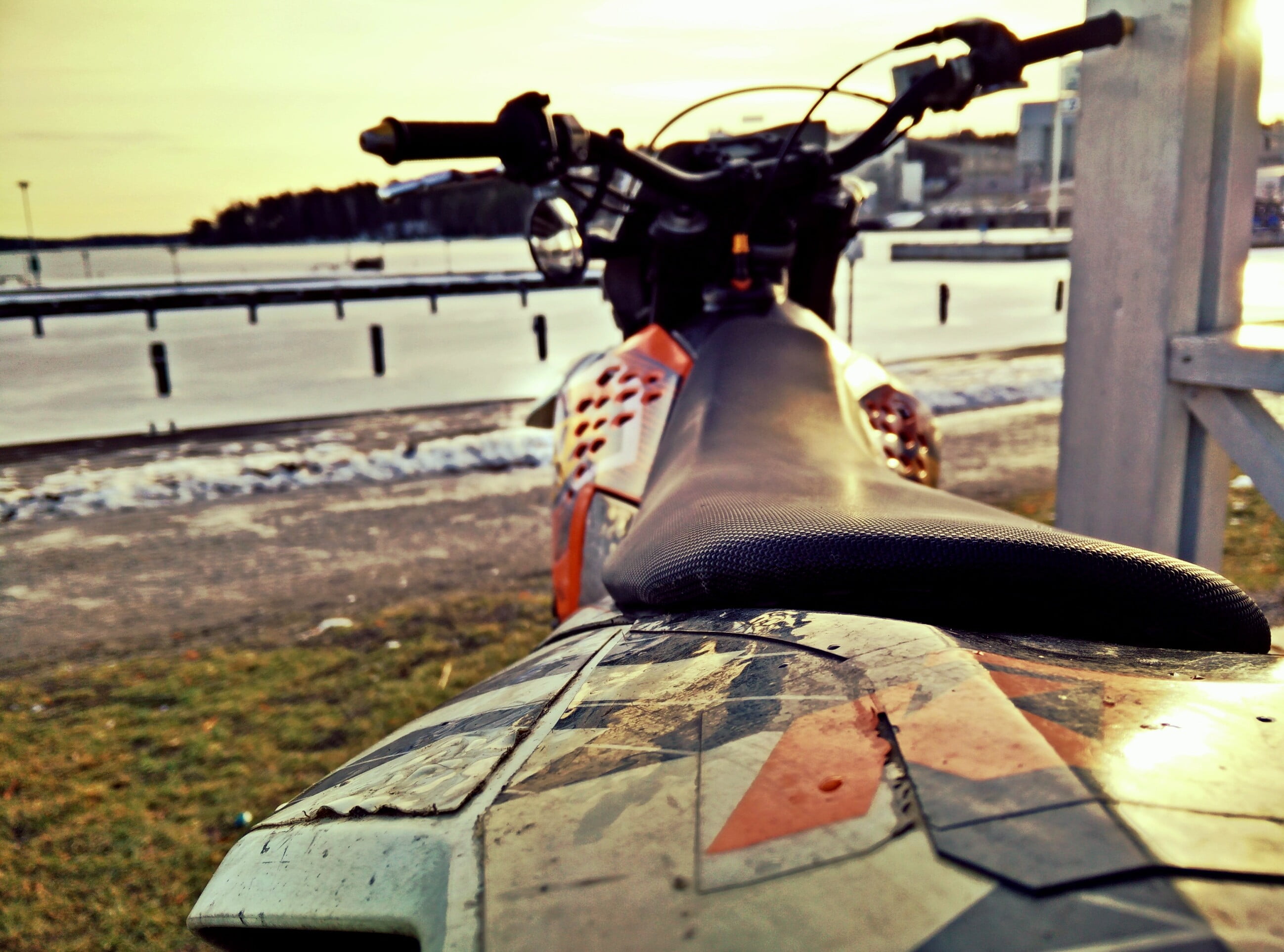 land vehicle, outdoors, sitting, focus on foreground, railing, 2K, perspective, KTM, water, motorcycle, leisure activity, real people, nature, bicycle, HD Wallpaper