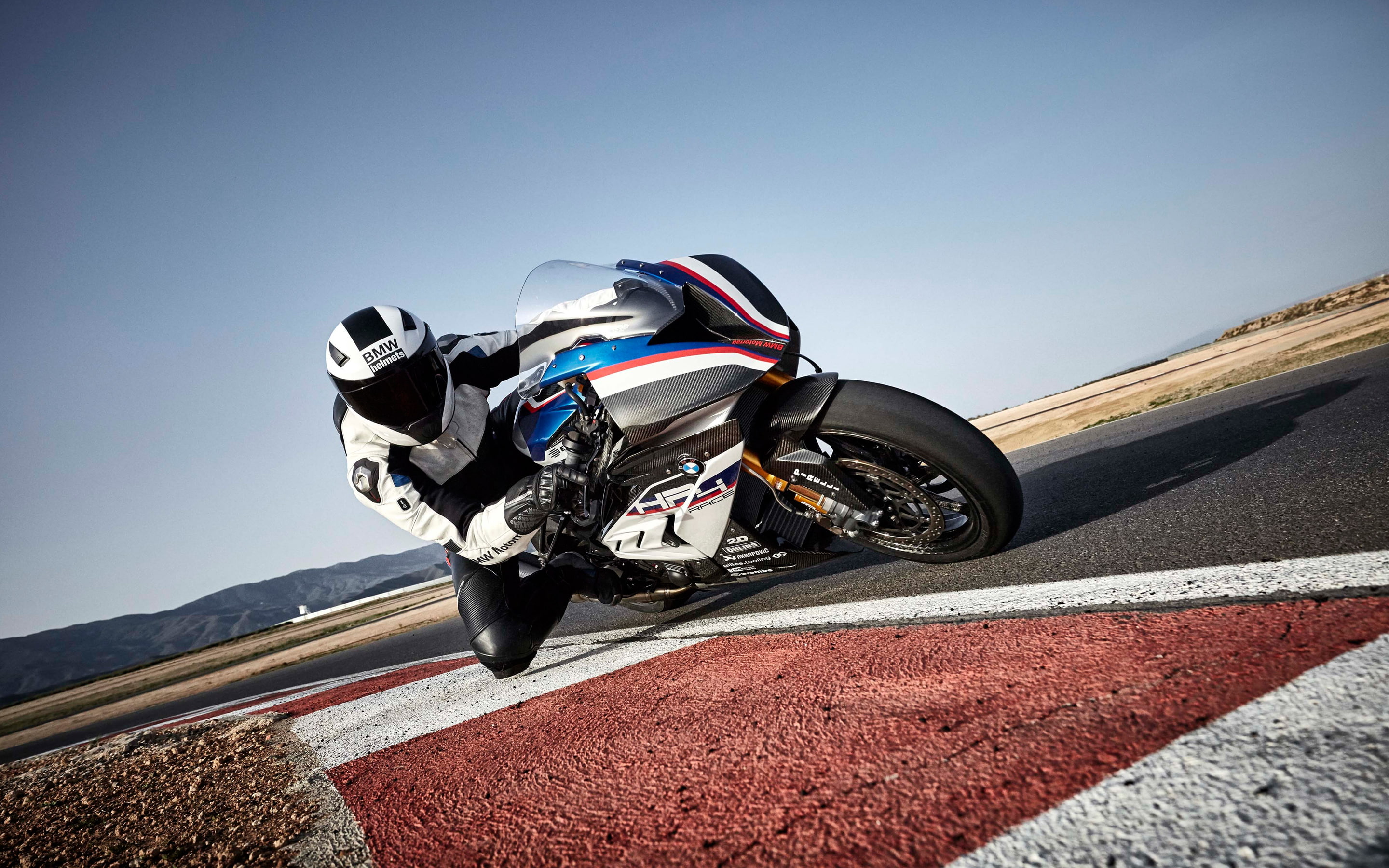 transportation, road, motion, mountain, sports race, 2K, extreme sports, hp, bmw, sport, non-urban scene, day, HP4, nature, sunny, sky, motorcycle, mode of transportation, HD Wallpaper