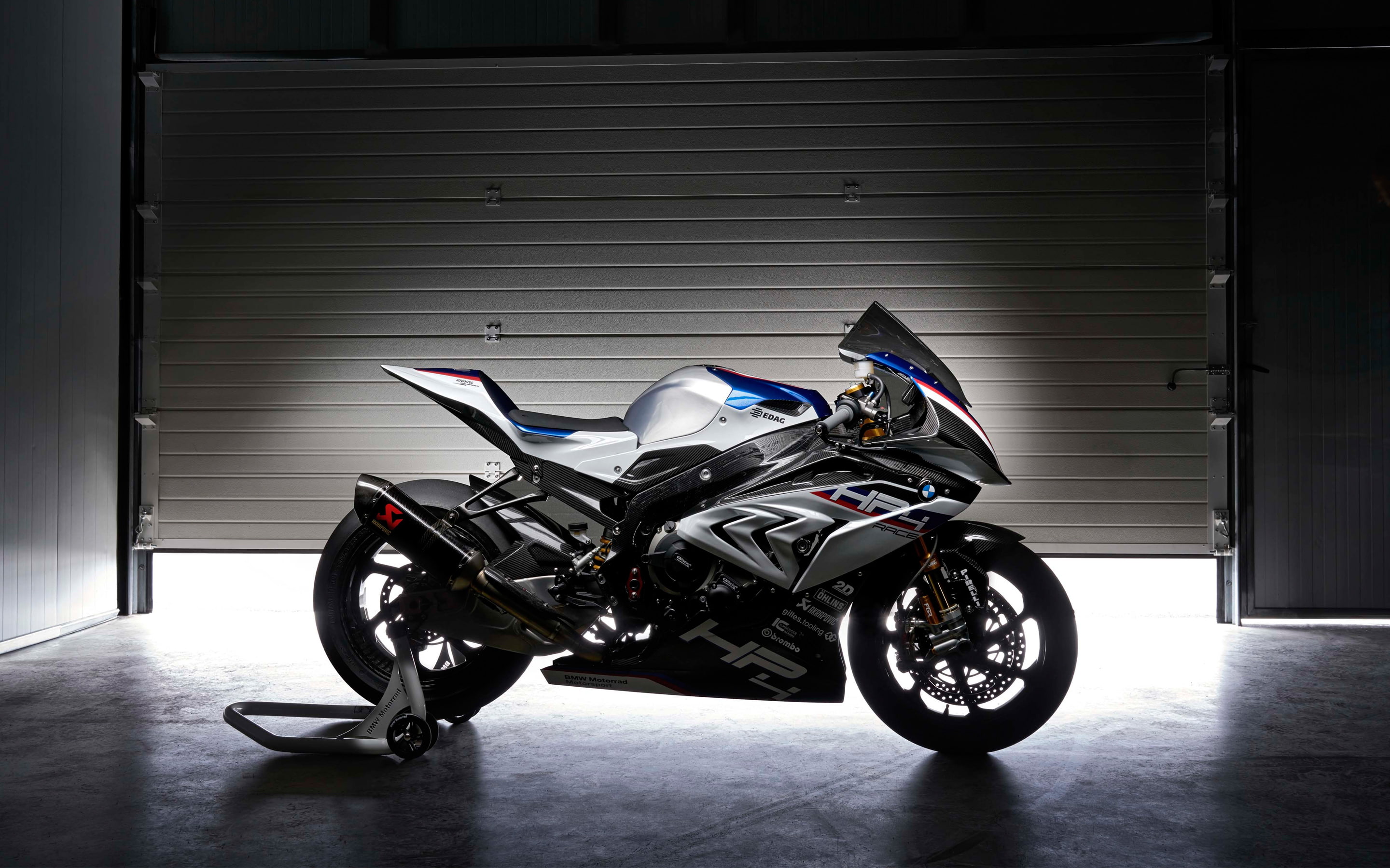 transportation, motorcycle, hp, safety, mode of transportation, k, day, side view, 2K, absence, stationary, protection, built structure, helmet, bmw, architecture, HD Wallpaper