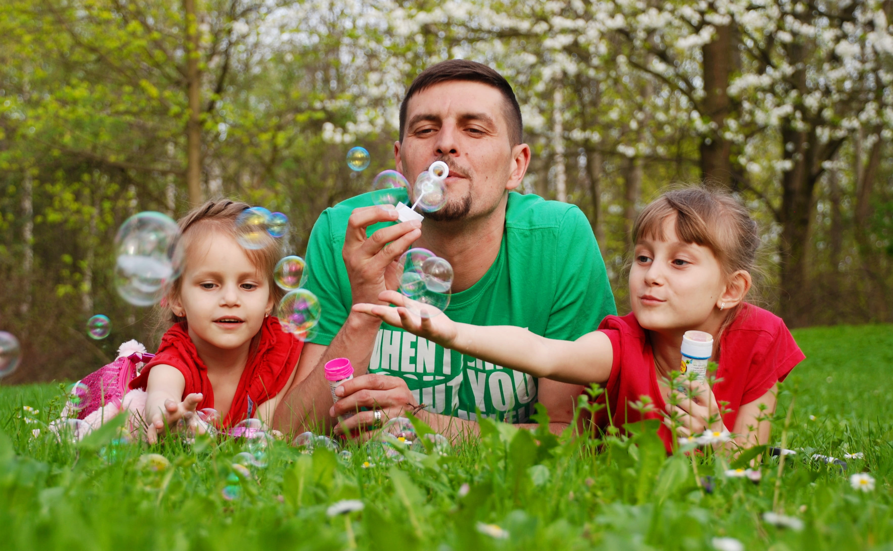 dad, portrait, outdoors, daytime, vacation, plant, baby, soap bubbles, stroll, forest, girls, adult, offspring, smile, two, playing, men, father, group of people, HD Wallpaper